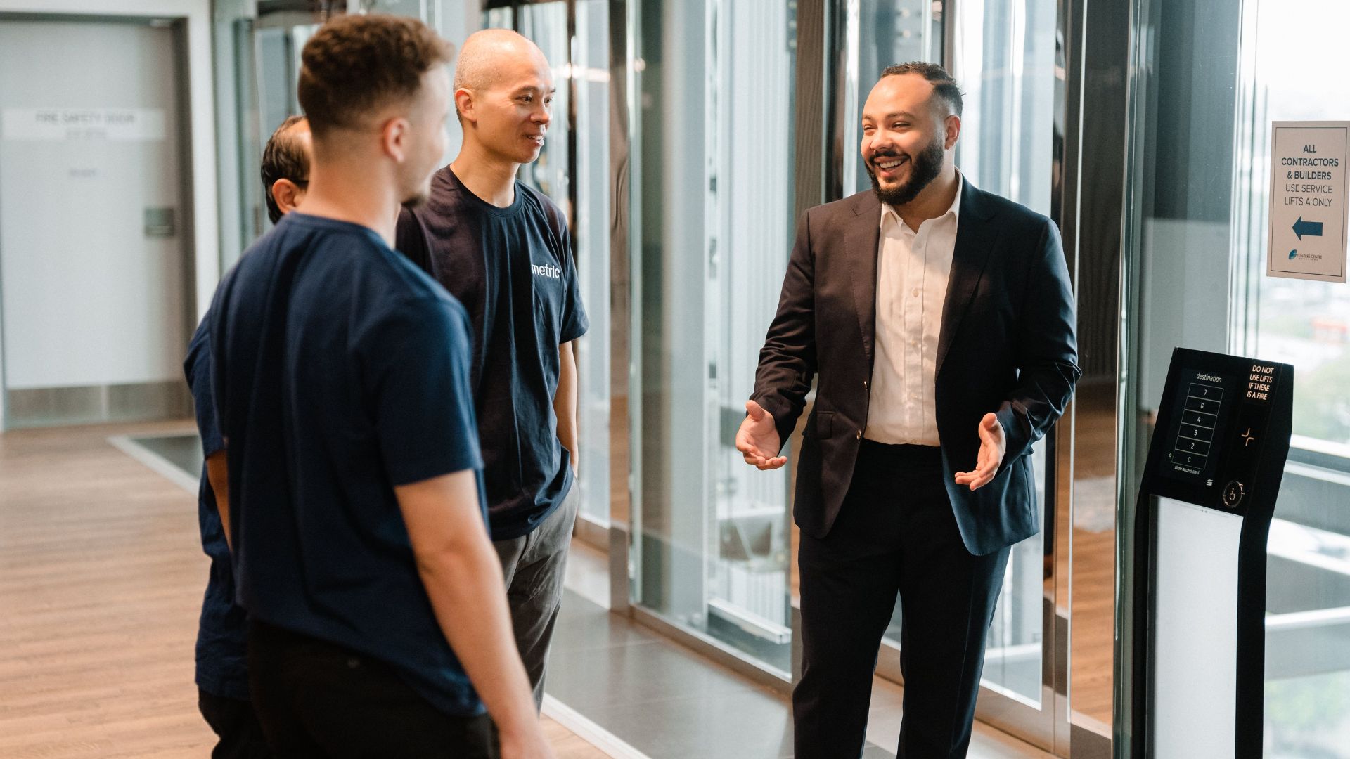 a man sitting in front of a laptop computer