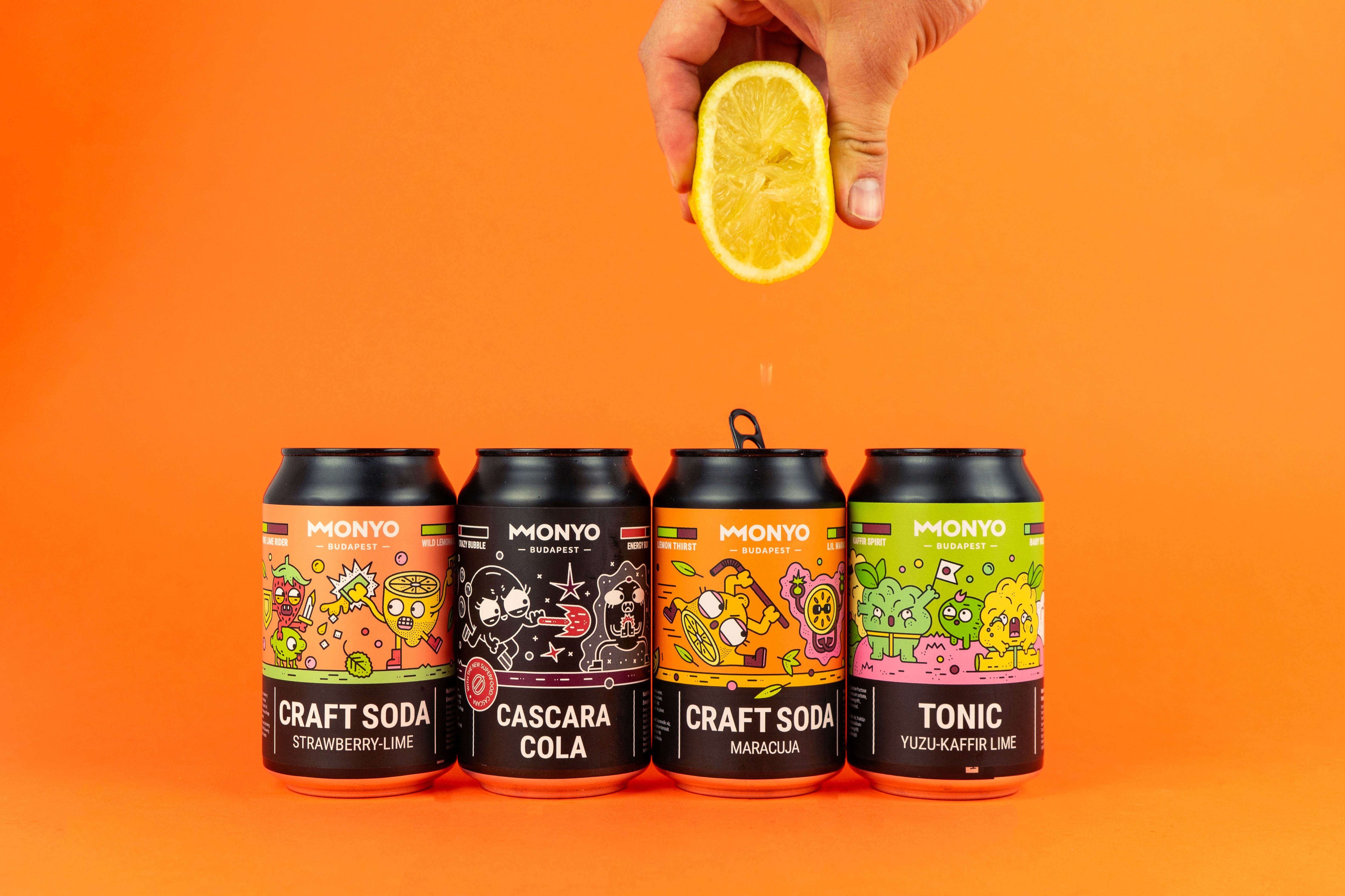 Woman in blue hat and sweater sitting on couch with laptop.