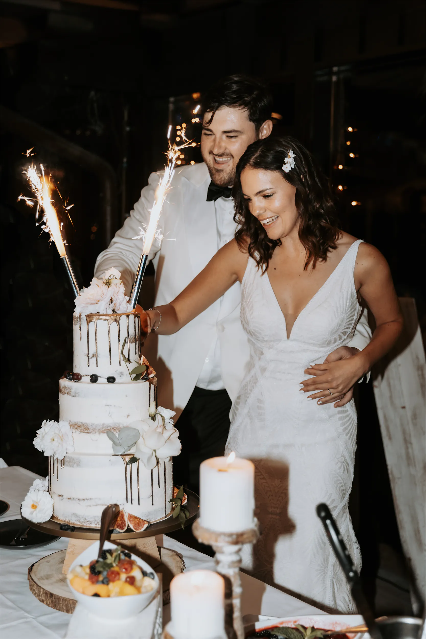 Cinematic black-and-white wedding photo of bride and groom while a wedding photoshoot
