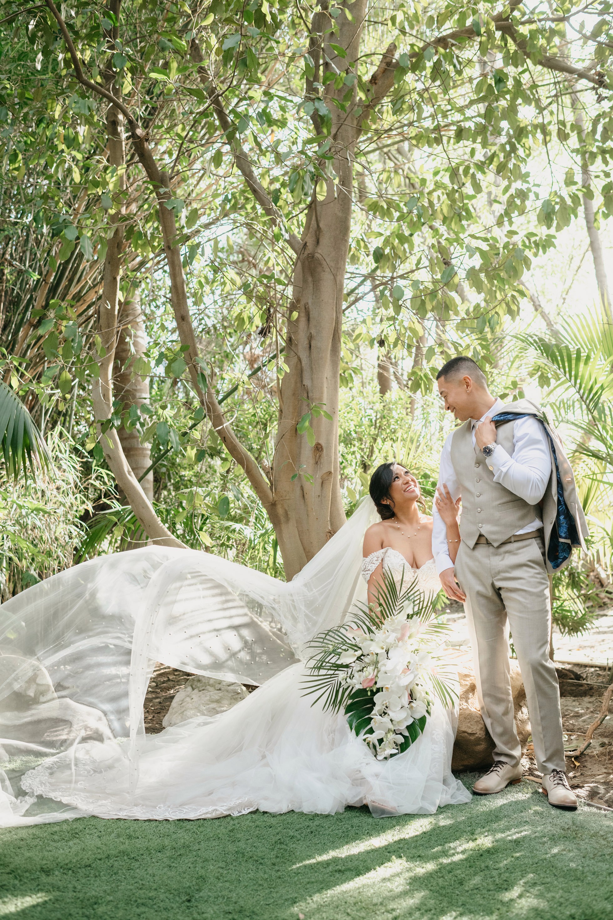 Romantic bride and groom portraits in lush greenery at Hartley Botanica