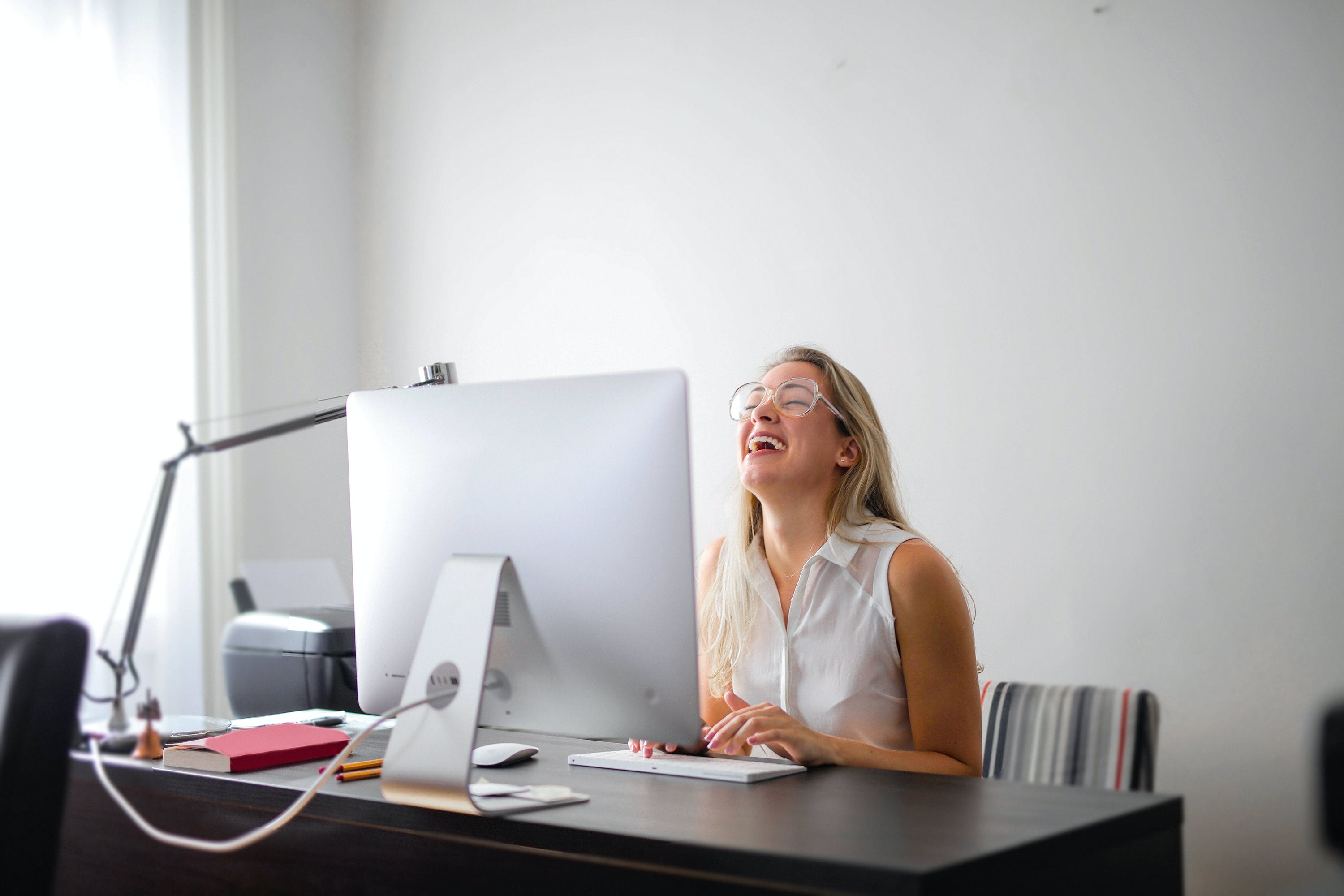 Woman lauging maximizing cold email success