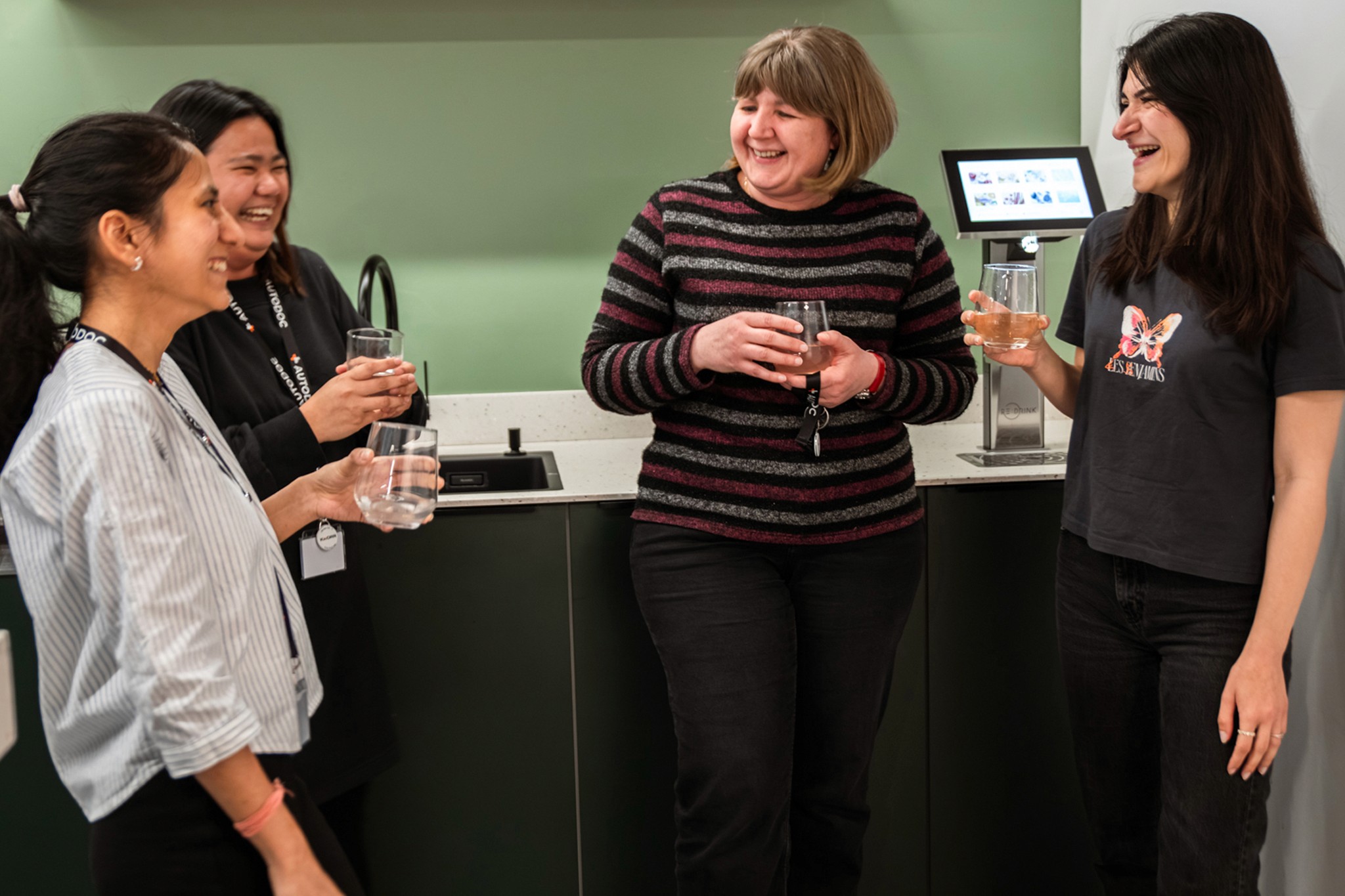 AUTODOC Team standing around Redrink laughing
