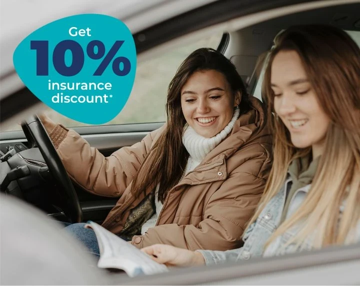 Young Driver just past her driving test smiling in vehicle with black box telematics car insurance