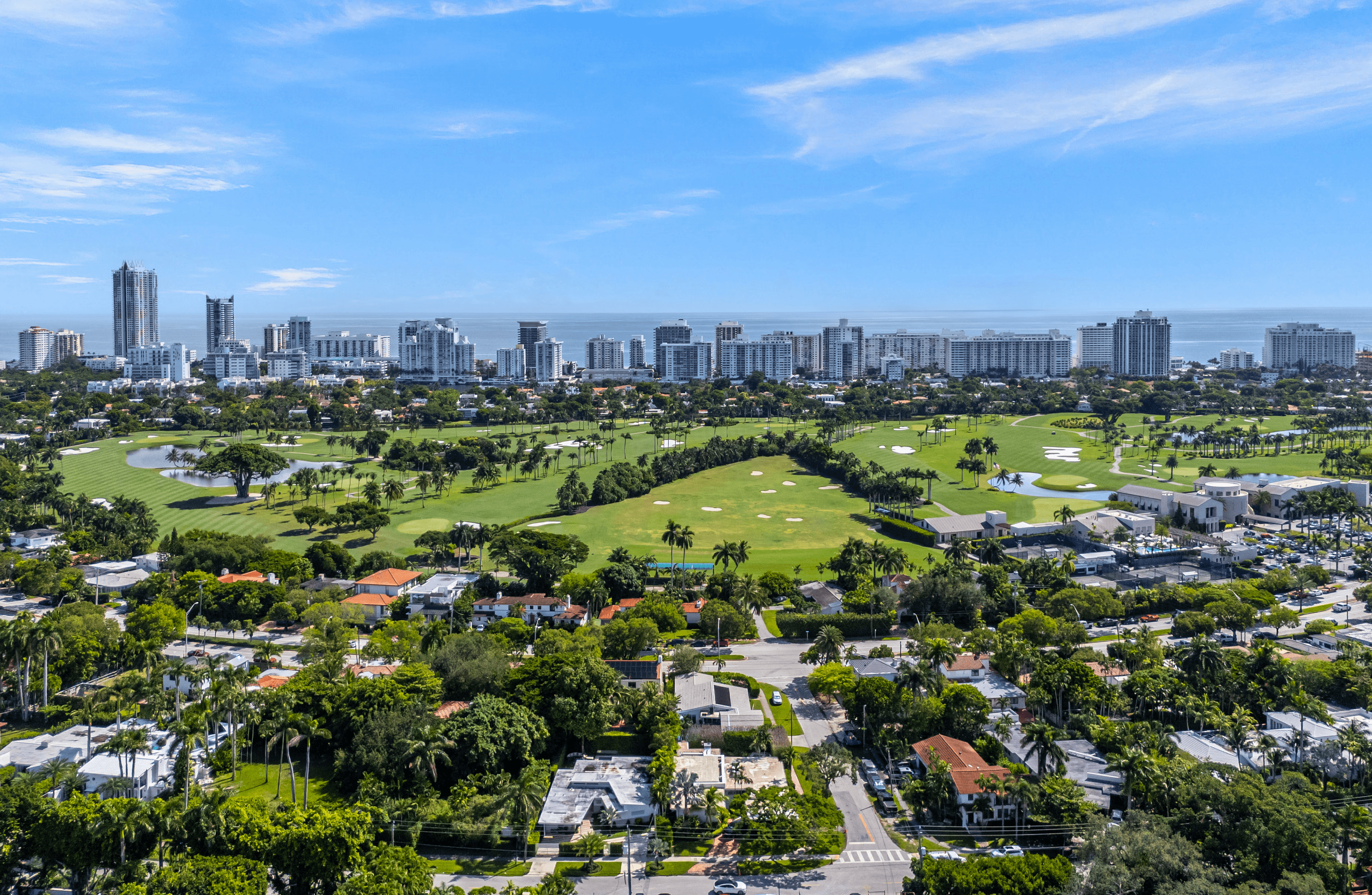 The wedding backdrop is the open sea, shimmering under late afternoon light