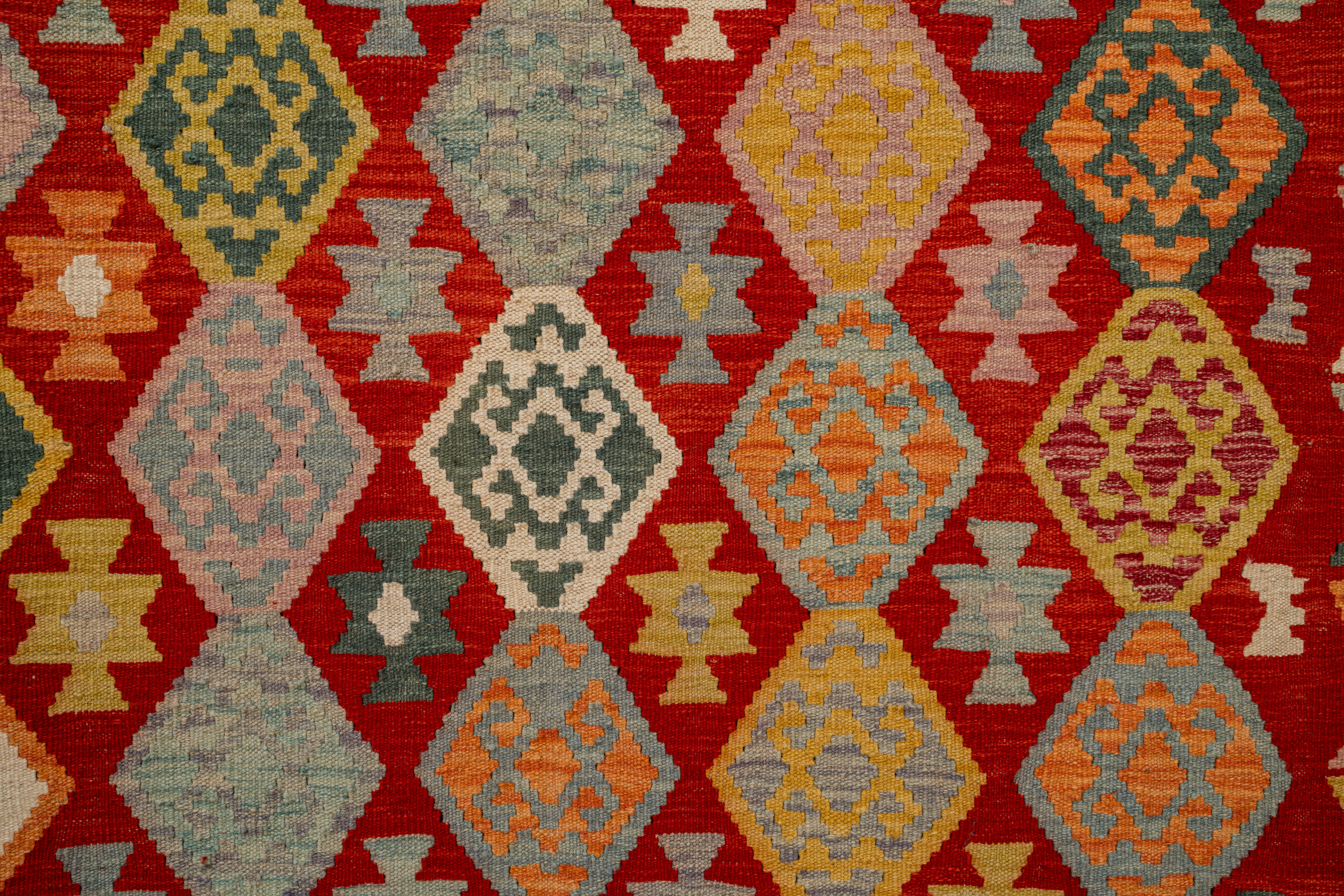 Colorful diamond pattern on a red background