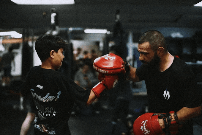 Children practicing martial arts in a supervised group class.