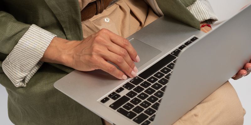 A female business owner typing on her laptop