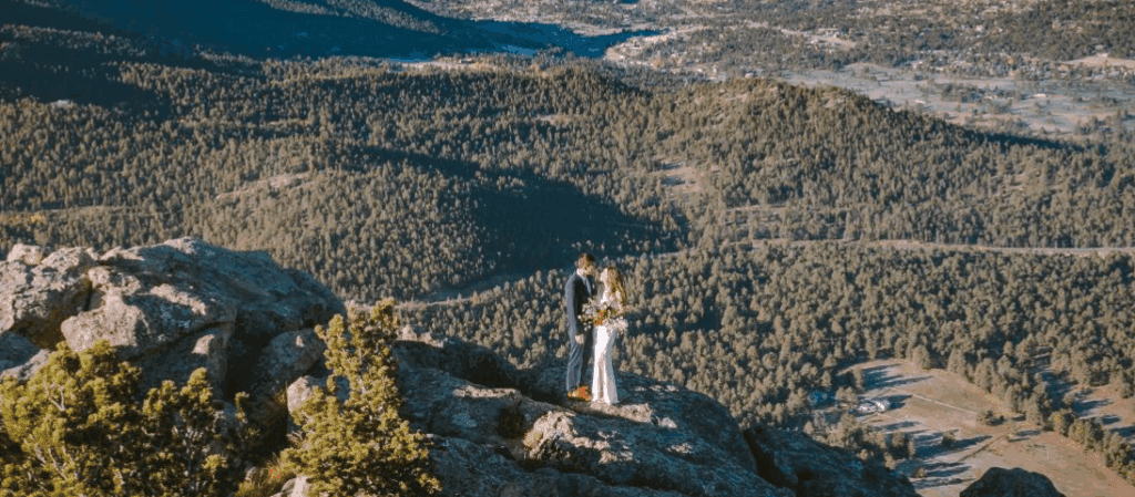 Wedding couple on a mountain overlook in the Elk Lodge area of Colorado.