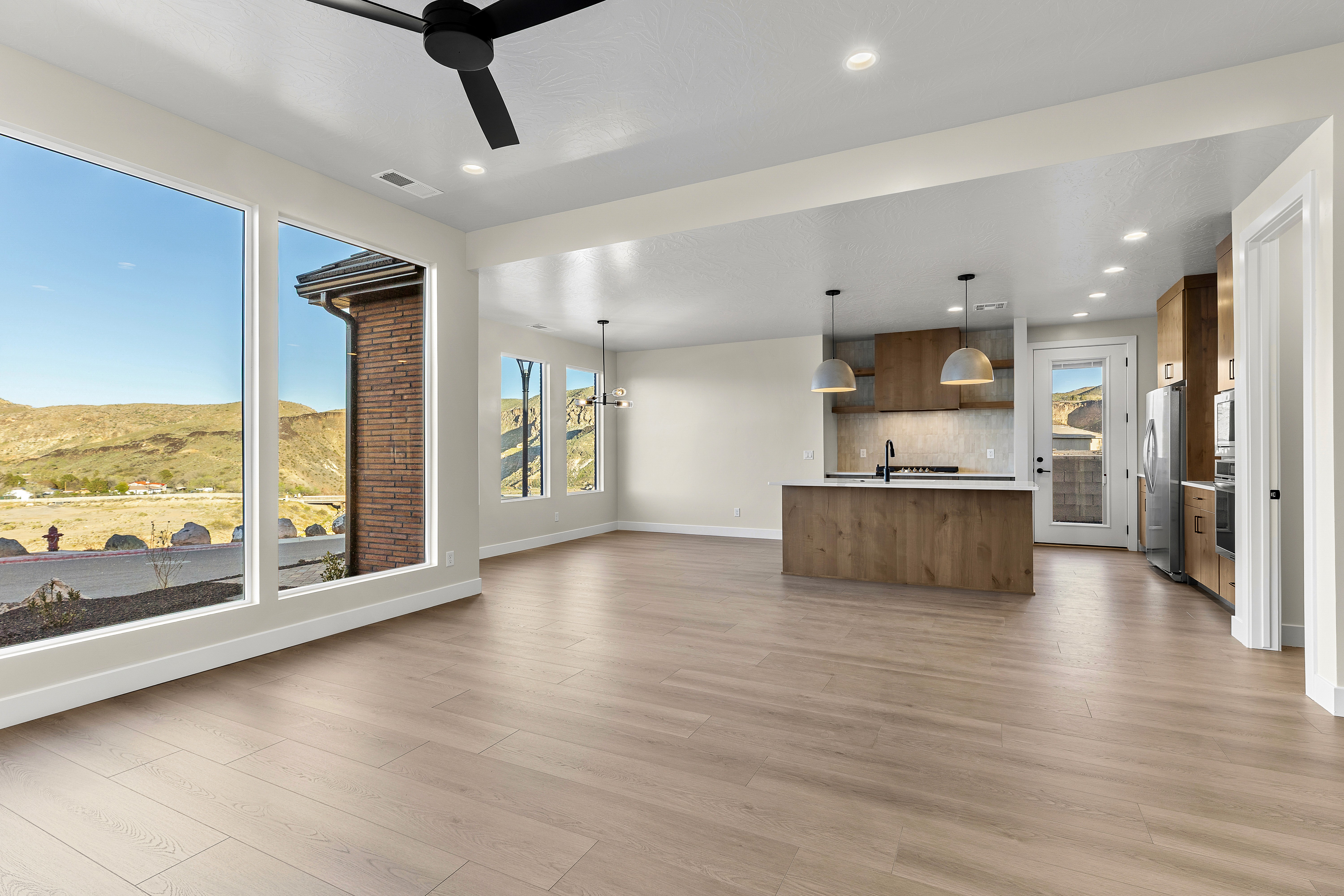 Open kitchen design in a Hurricane Utah home connected to living and dining areas