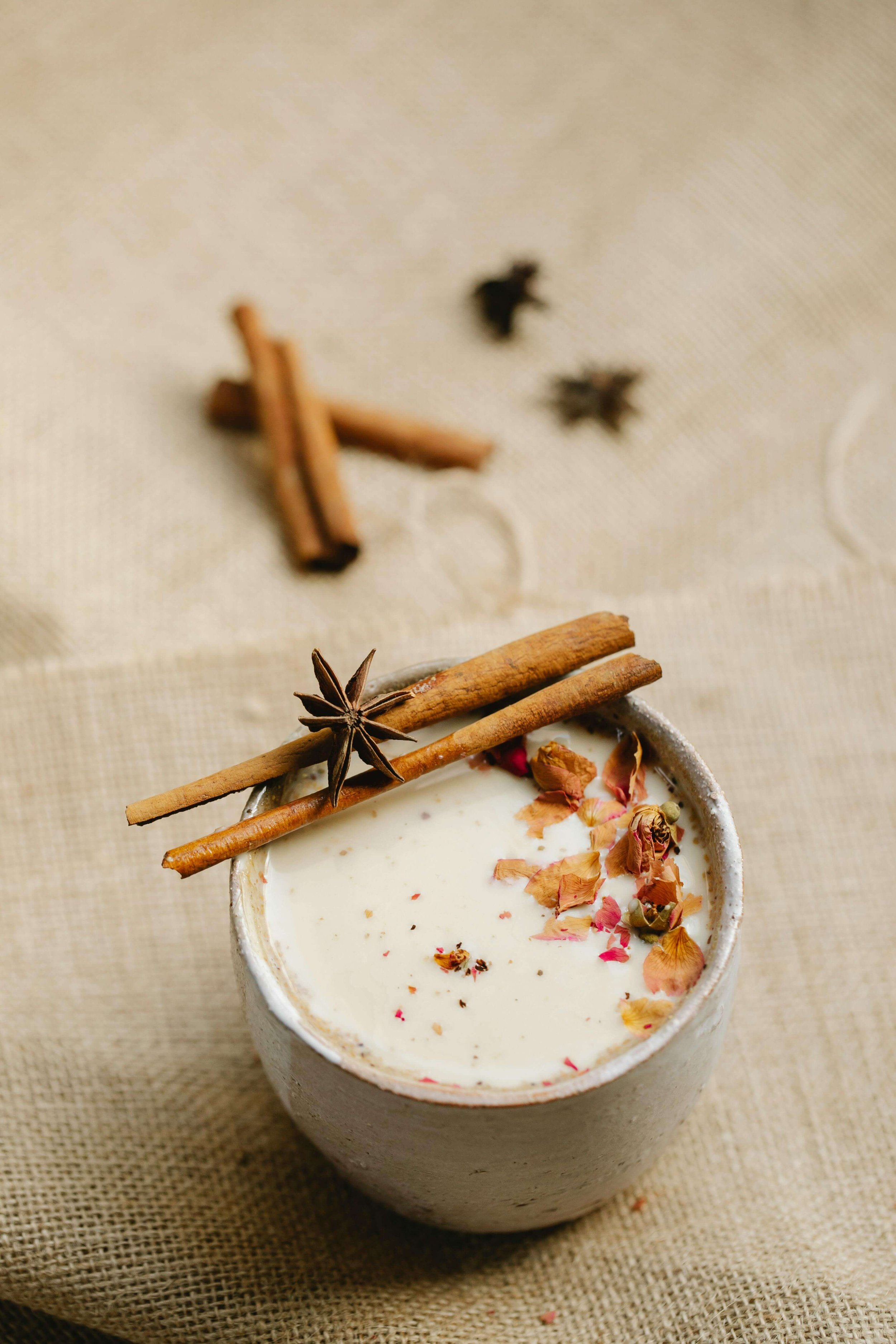 a chai tea latte in a tan mug