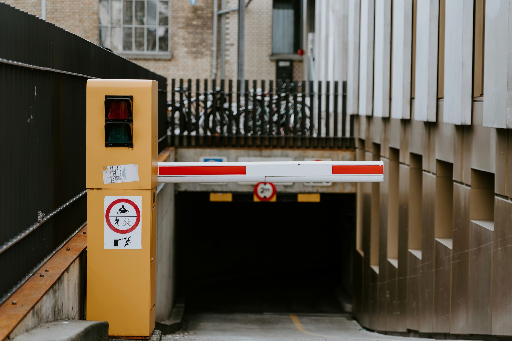 A driveway with an automated gate system.