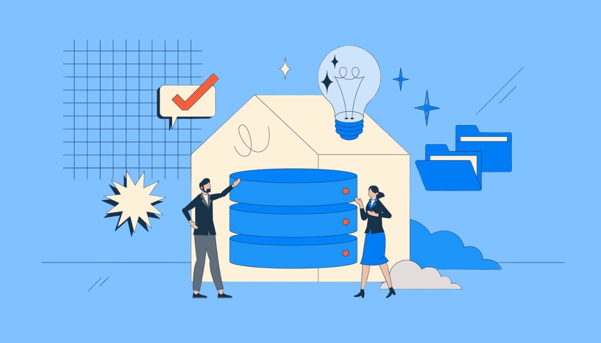 Illustration of two professionals standing beside a stack of server‑like data disks inside a house‑shaped frame, with a large light bulb above them and surrounding icons for checkmarks, folders, and ideas.