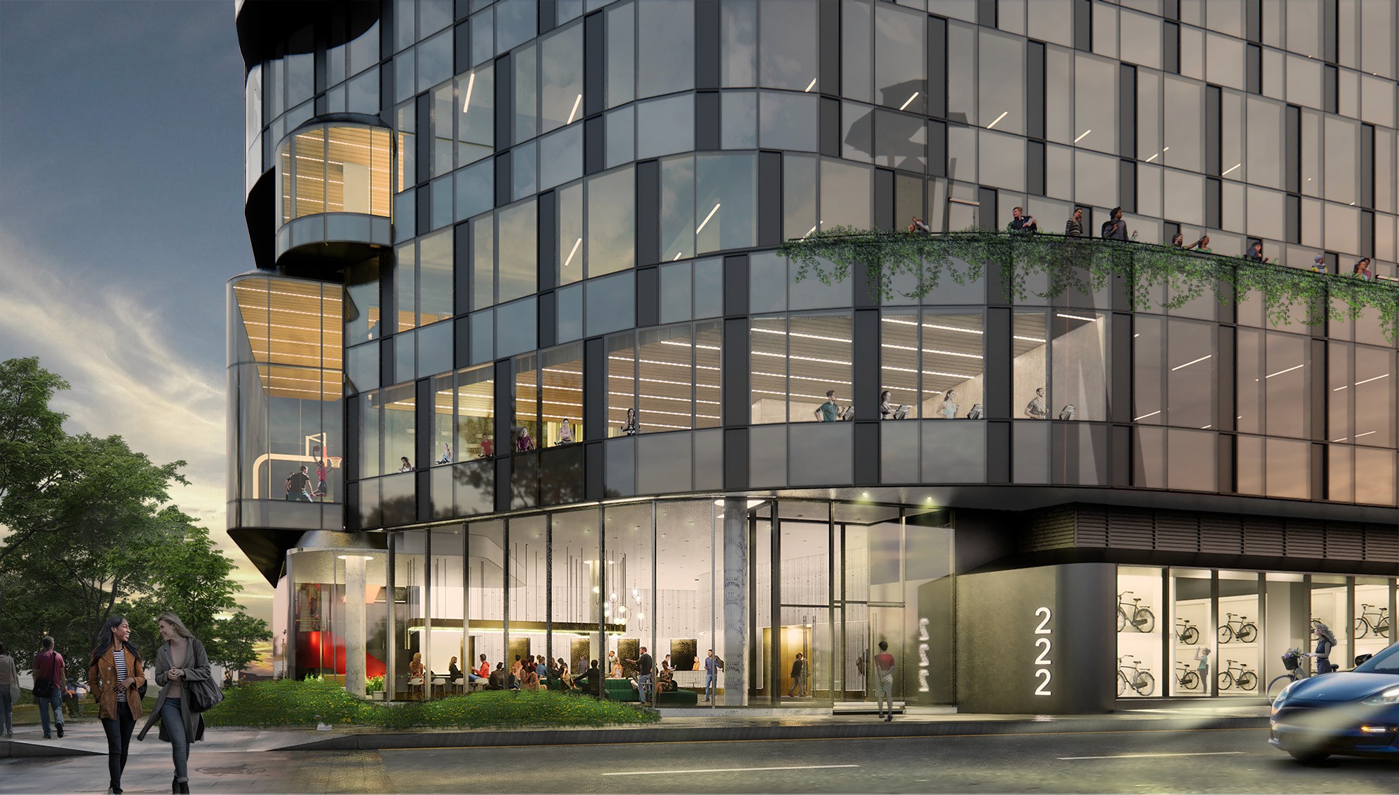 Northwest building corner showcasing a vibrant, highly transparent lobby and main entry.