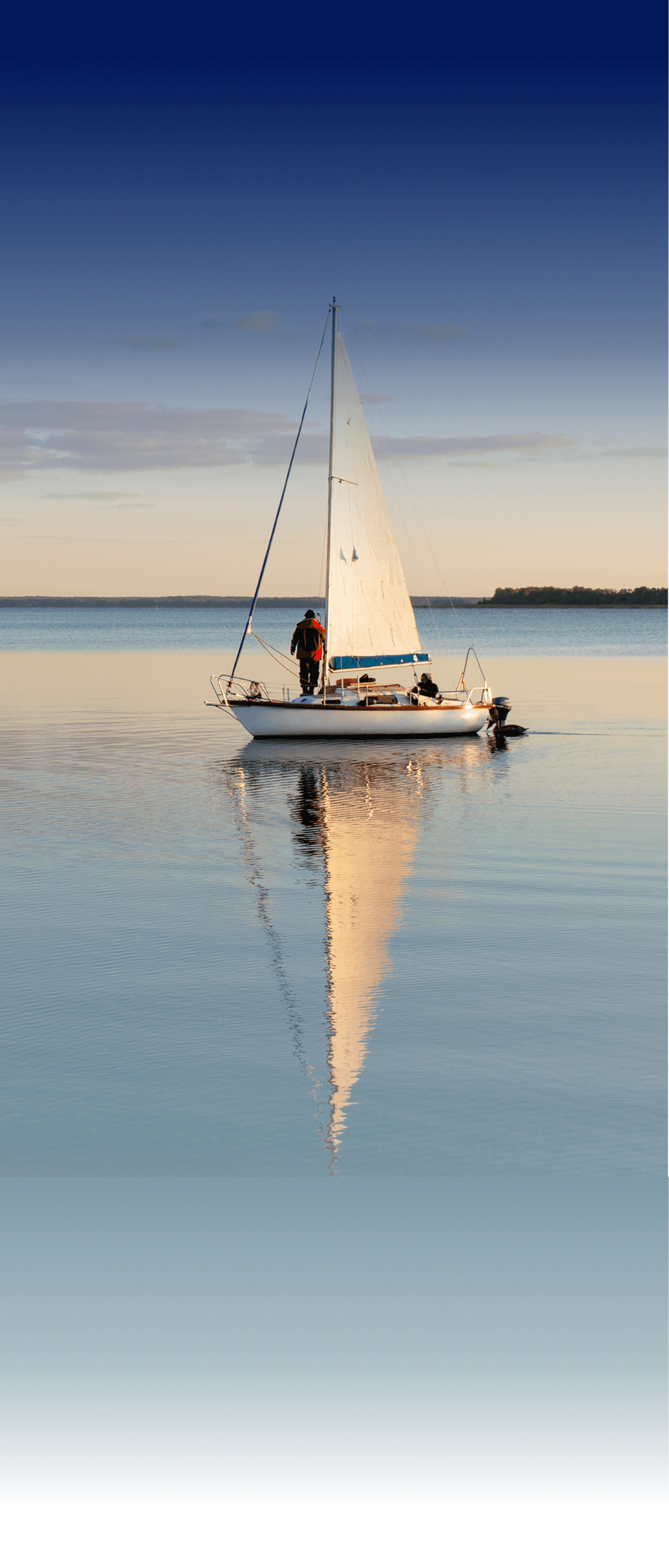 A person sailing their boat on a Swiss Lake