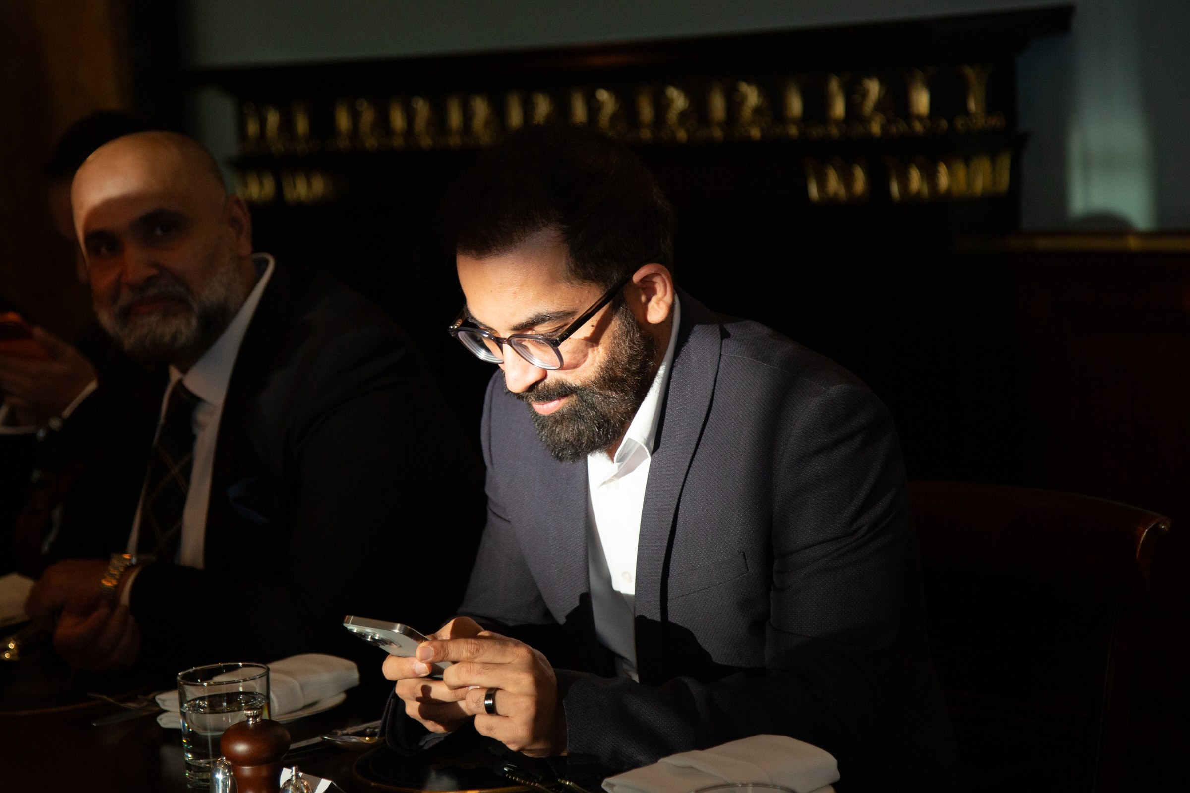 BRAND PHOTOGRAPHY · A candid moment at a formal event.