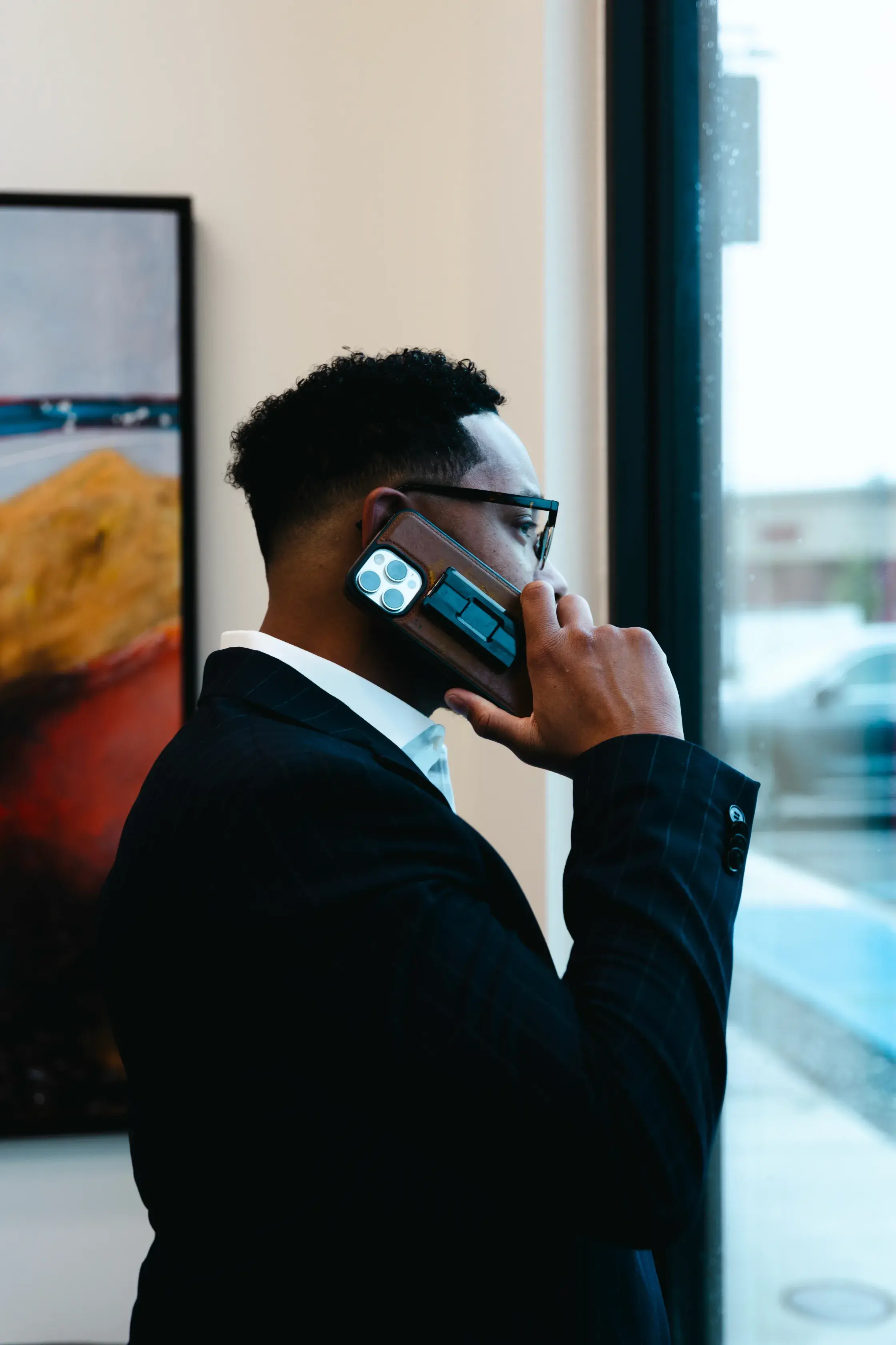 Chris Lewis on the phone speaking with a customer.