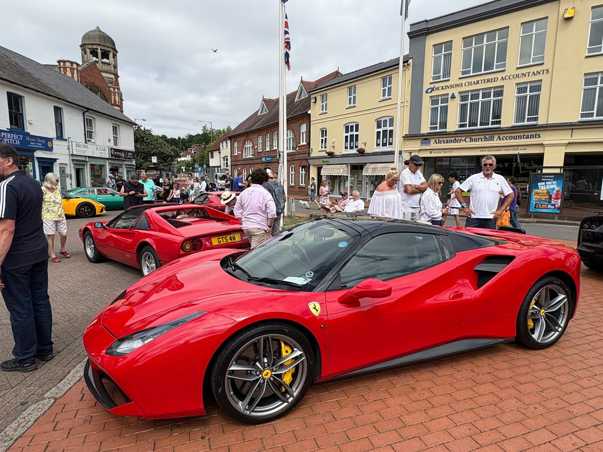 two people in a workspace working on their laptops 