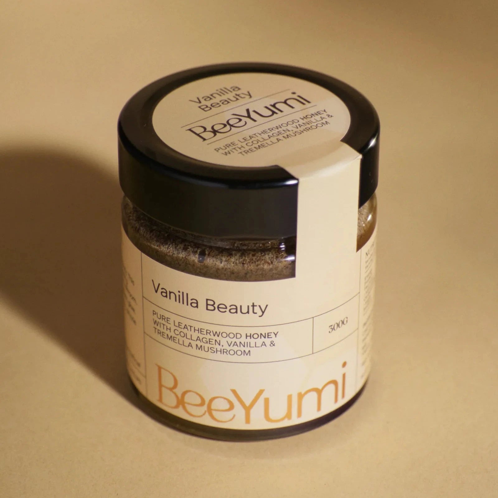 Jar of 'Vanilla Beauty' by BeeYumi on a beige background