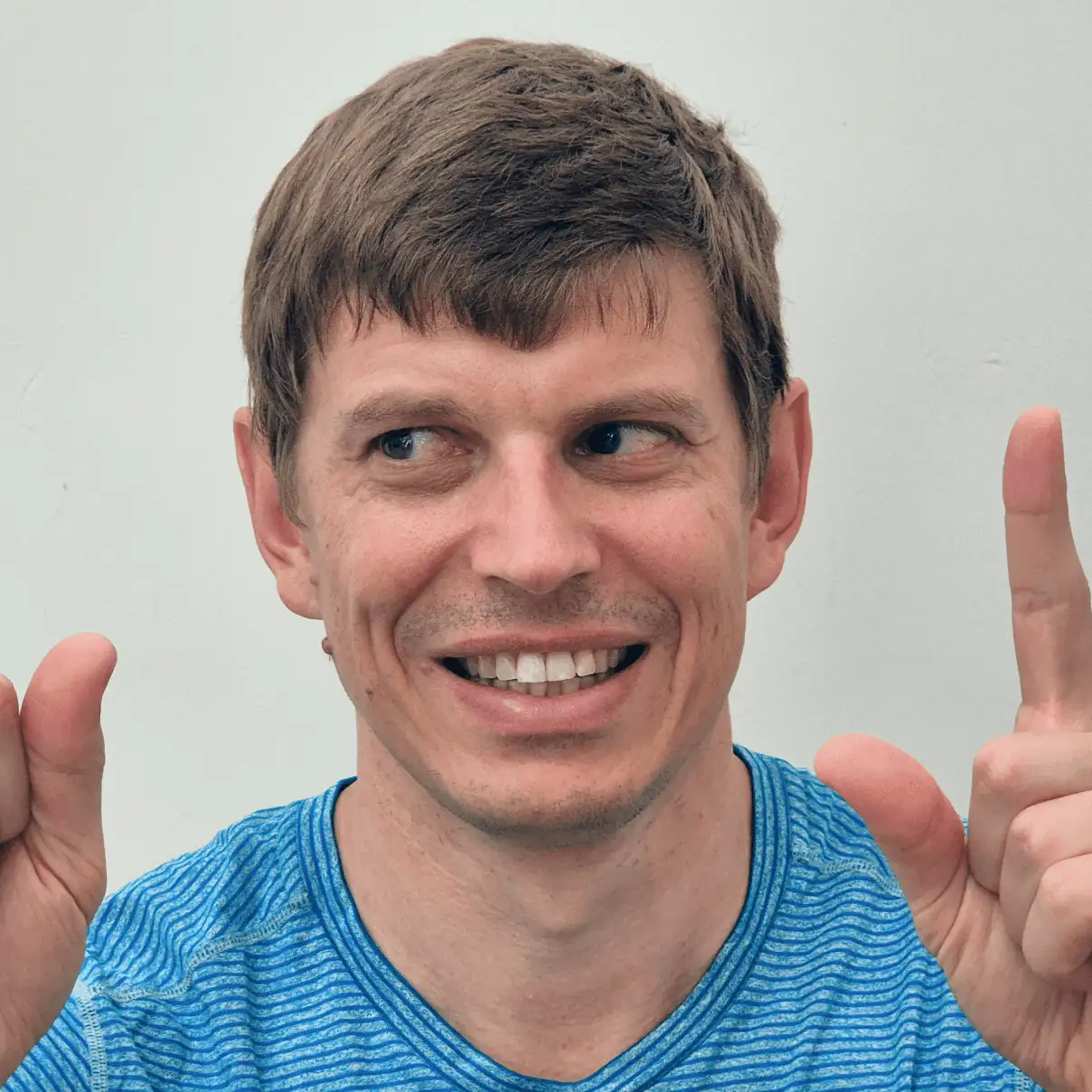 A patient tracks theirs eyes between both hands directly in front of their face to test for concussion sensitivity