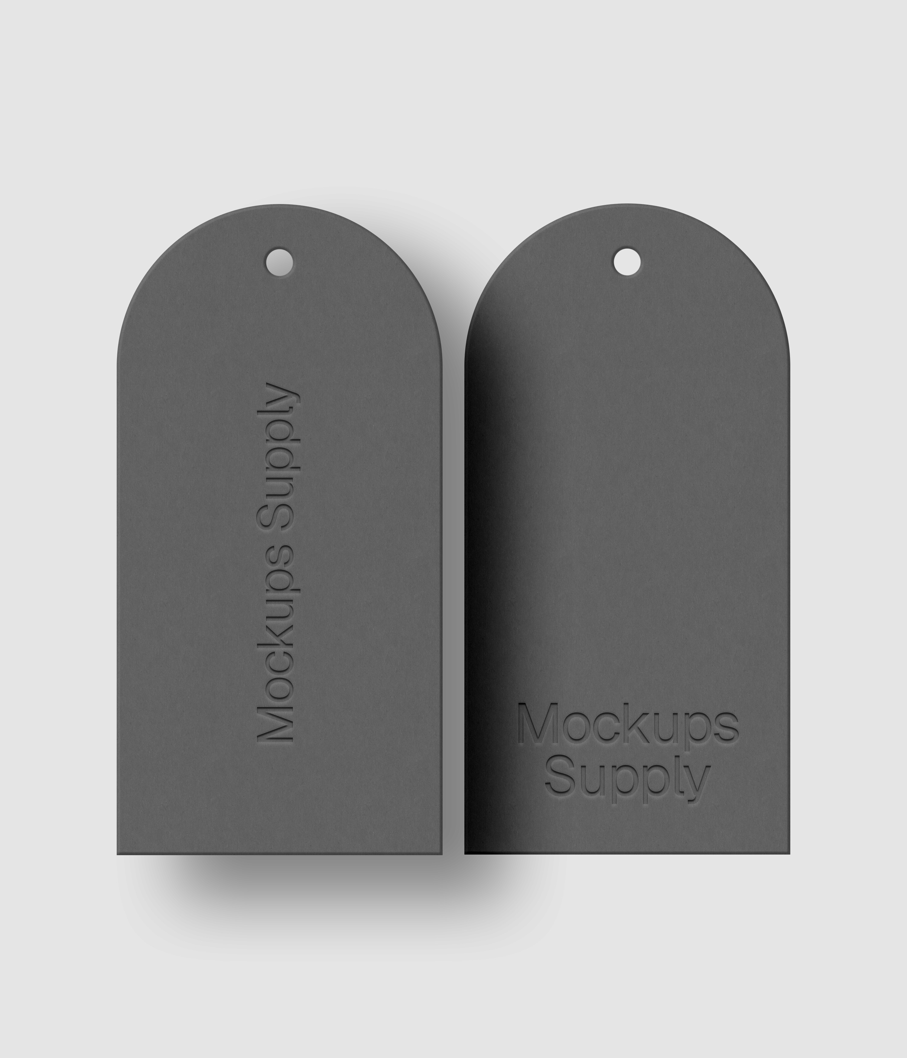 Pair of white arched top tags featuring letterpress pressed logo with customizable shadow and colors for clean branding presentation