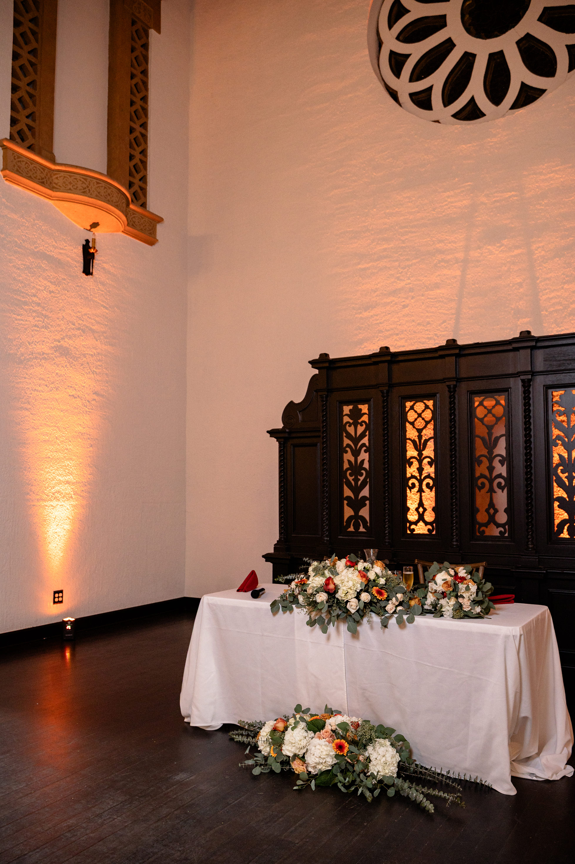 Flat lay wedding details with bouquet, rings, and sparkling bridal heels