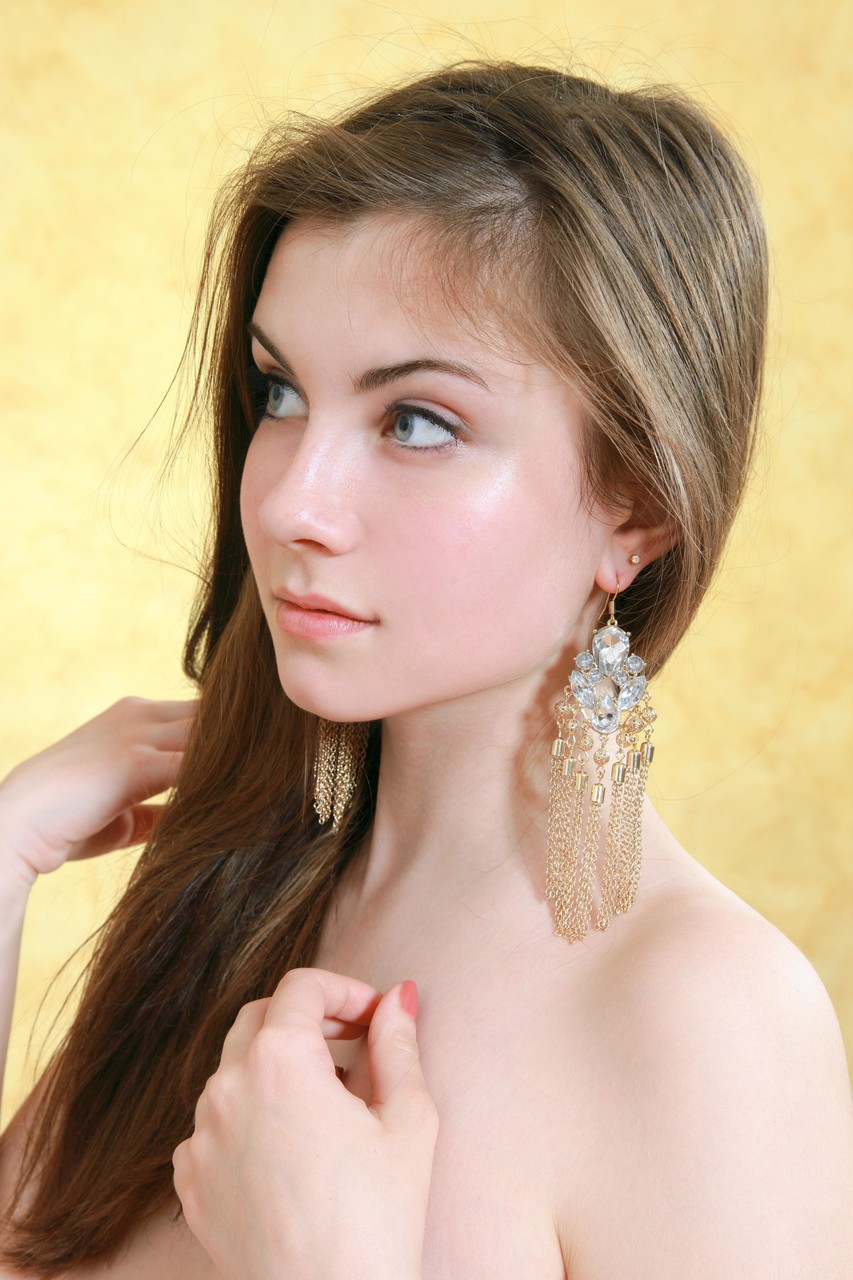 kids lying on a glass land and smiling