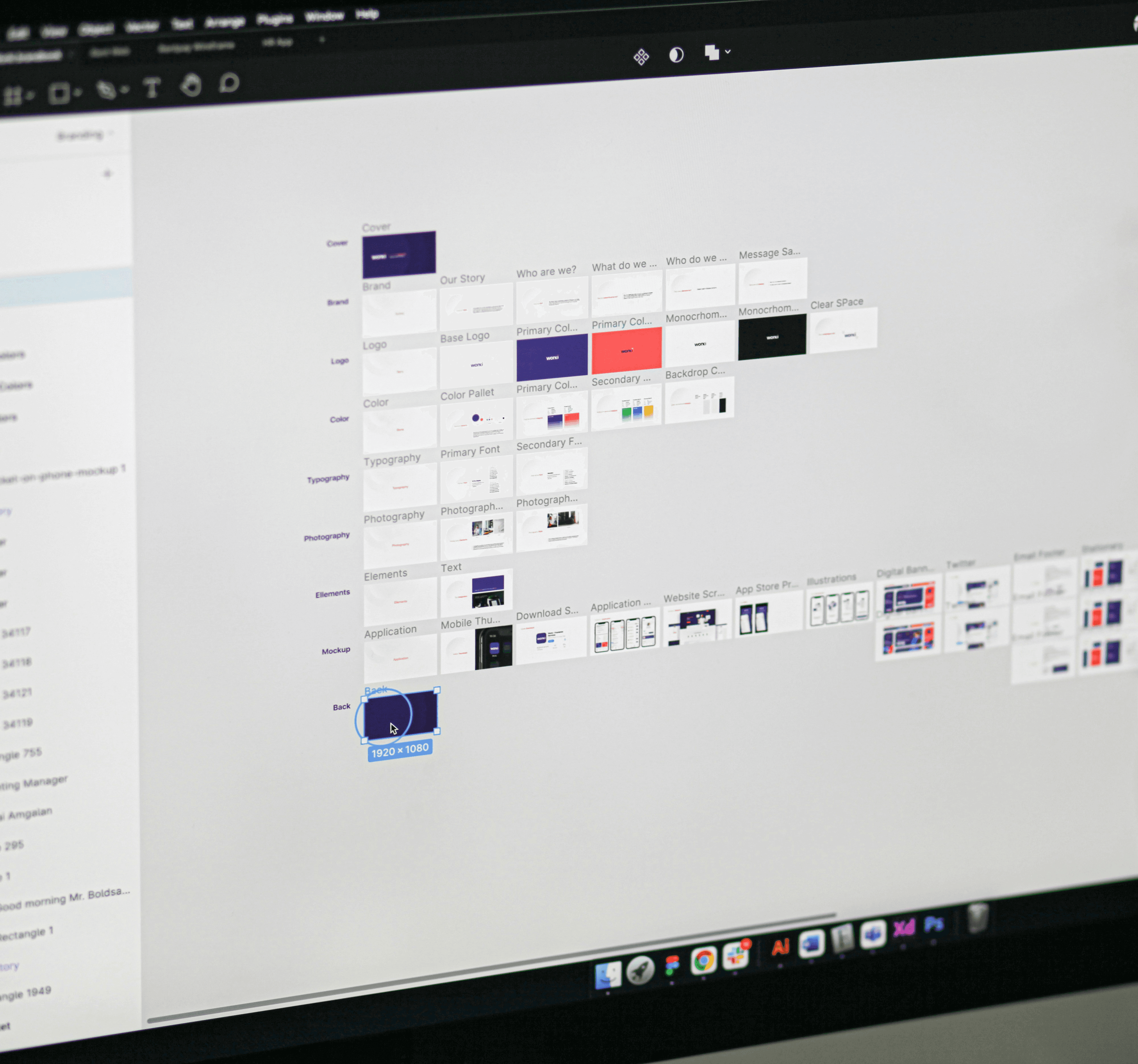 Person wearing black clothing carrying a black tote bag with a green globe-like geometric symbol, standing against a concrete wall in sunlight and shadow.