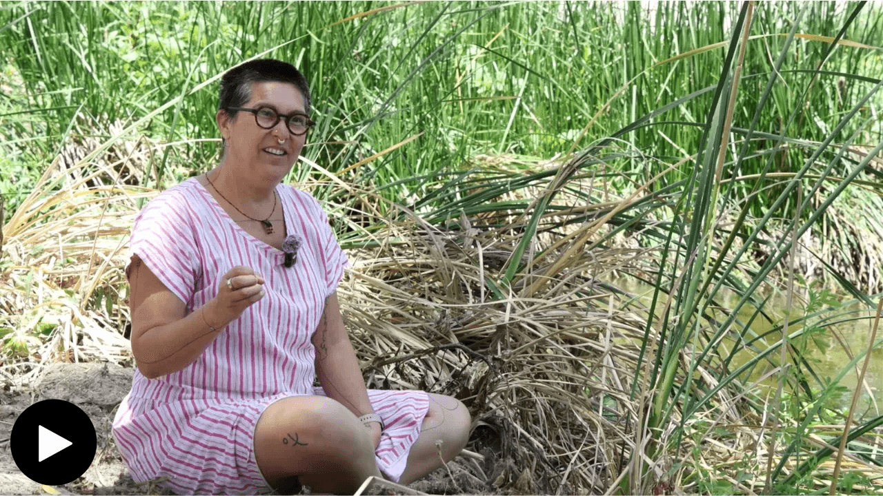 Tanya Aguiniga sitting in grass