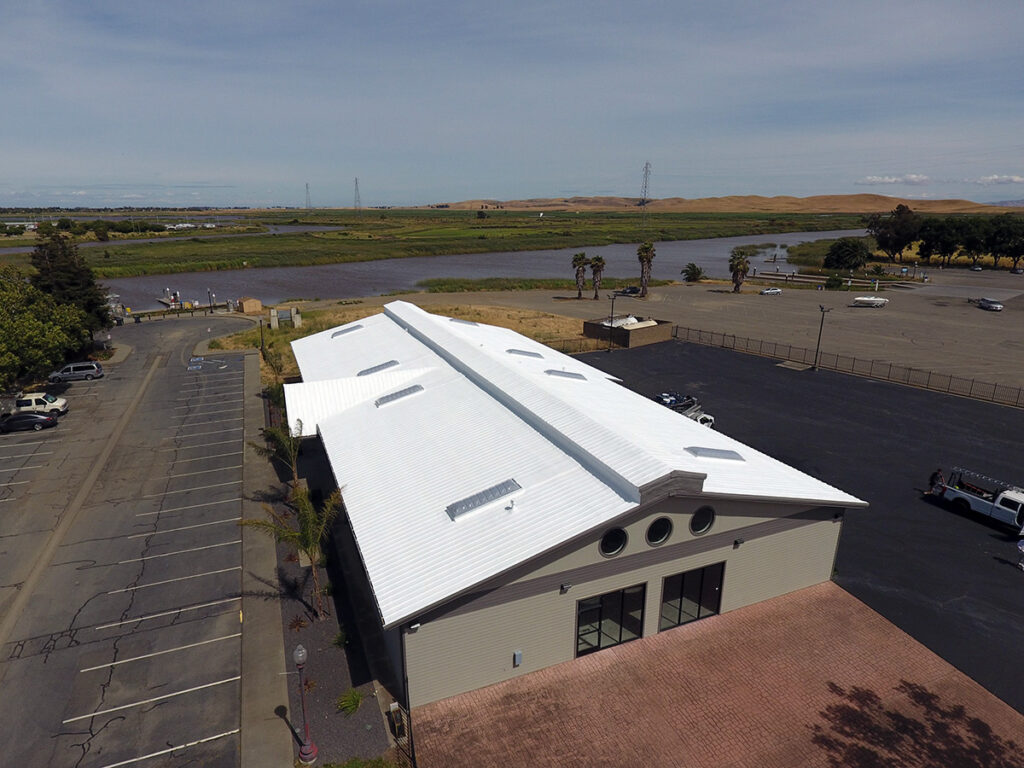 Suisun, California - 15,000 S.F: New spray foam roof with 15 year warranty over standing-seam metal with new skylights.