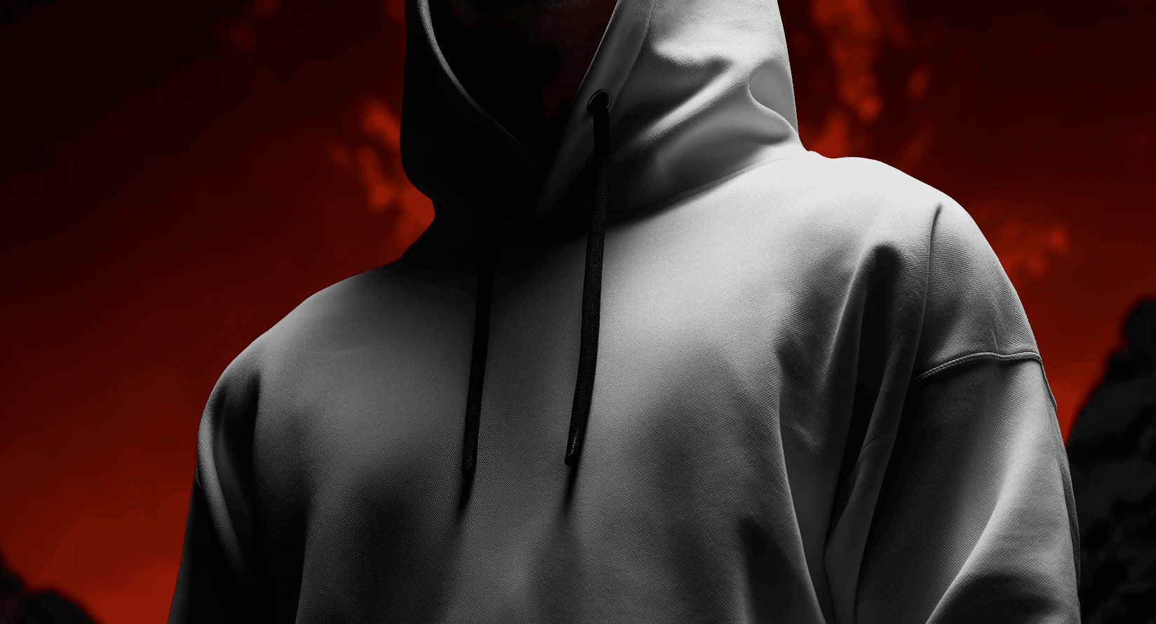 Person in white hoodie against a red background