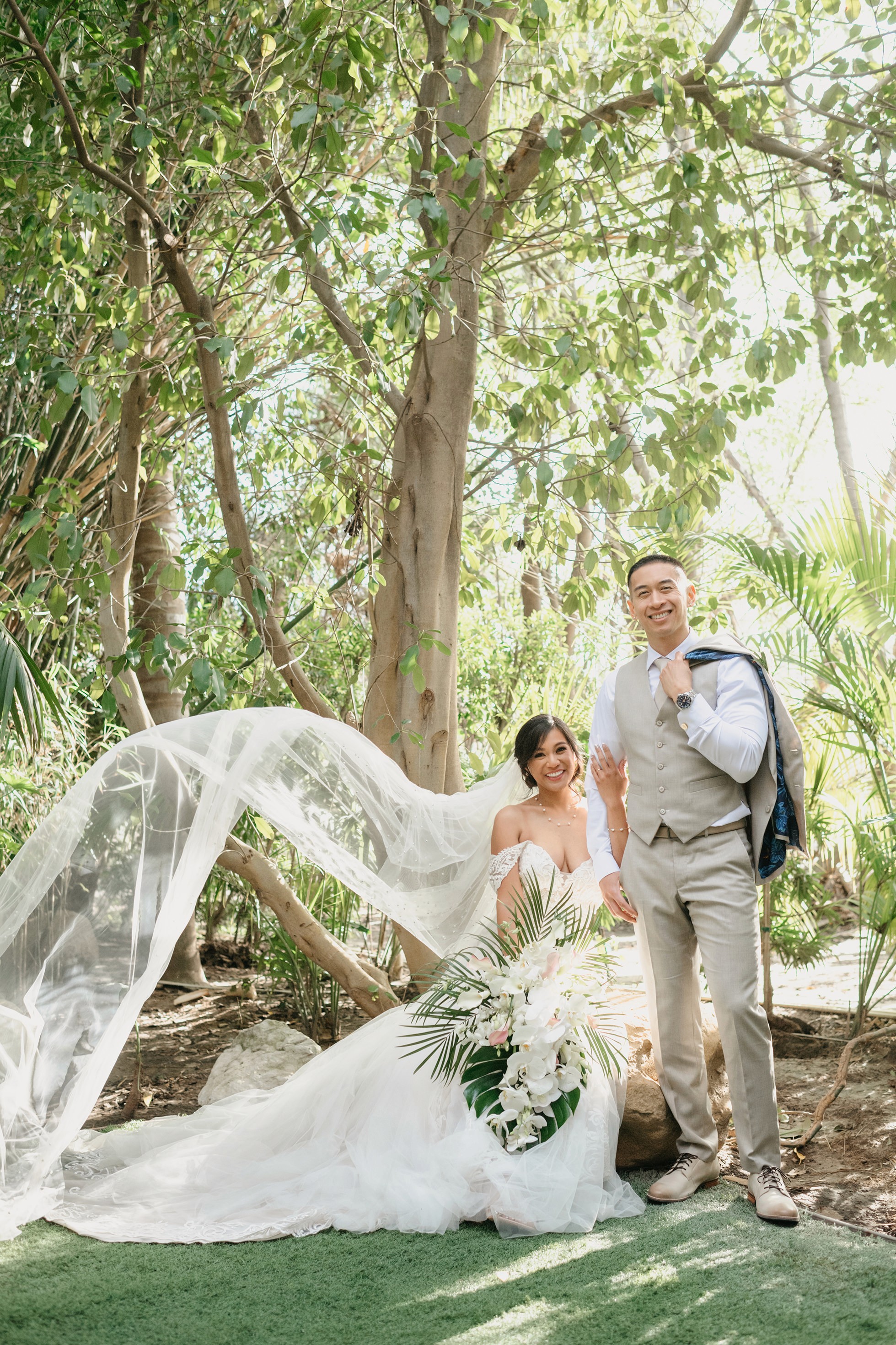Romantic bride and groom portraits in lush greenery at Hartley Botanica