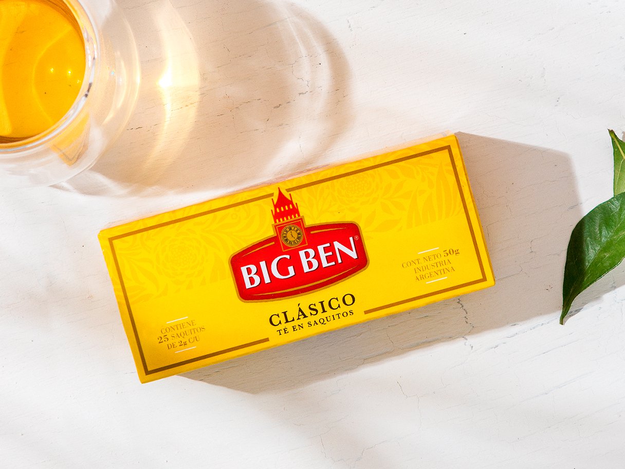 Rustic cabin in a golden field at sunset