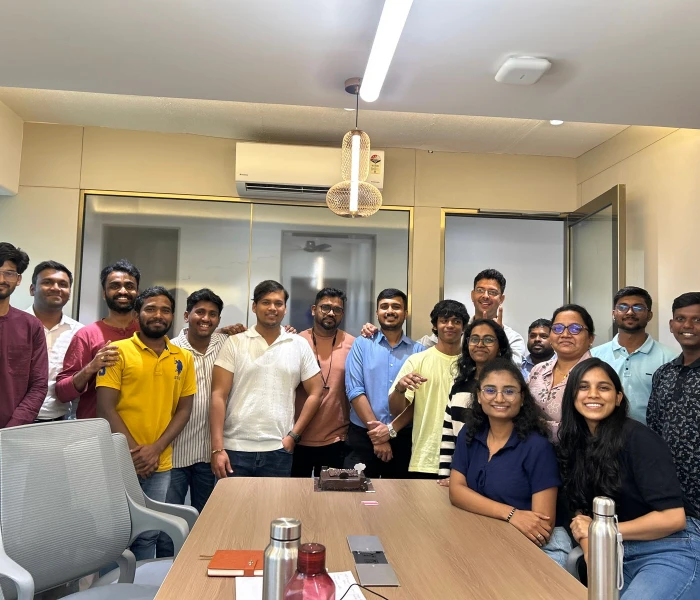 The image is from Instalogic, business intelligence solutions, showing employees at a team celebration.