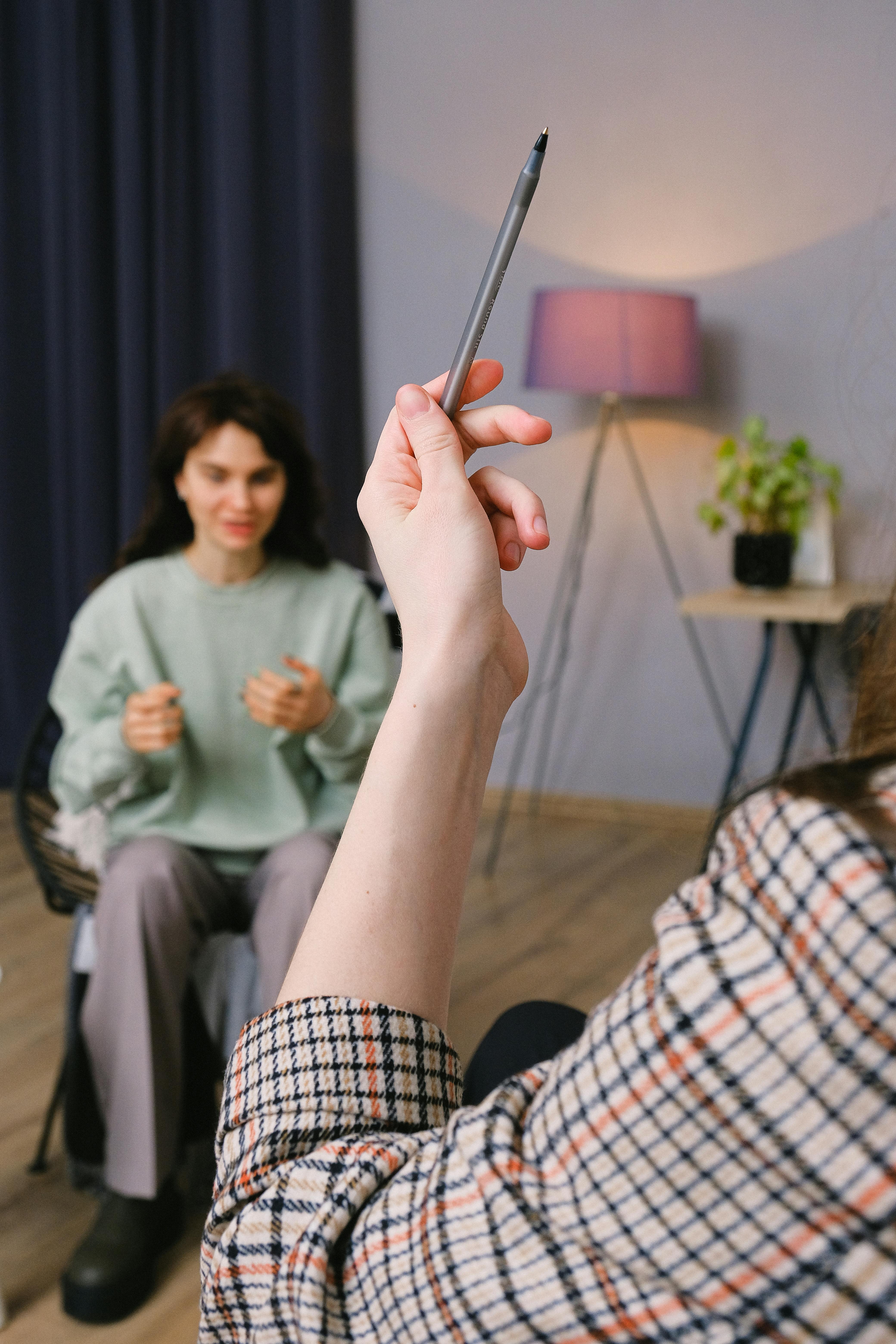 A woman receives a relaxing energy healing in a serene setting with soft lighting.