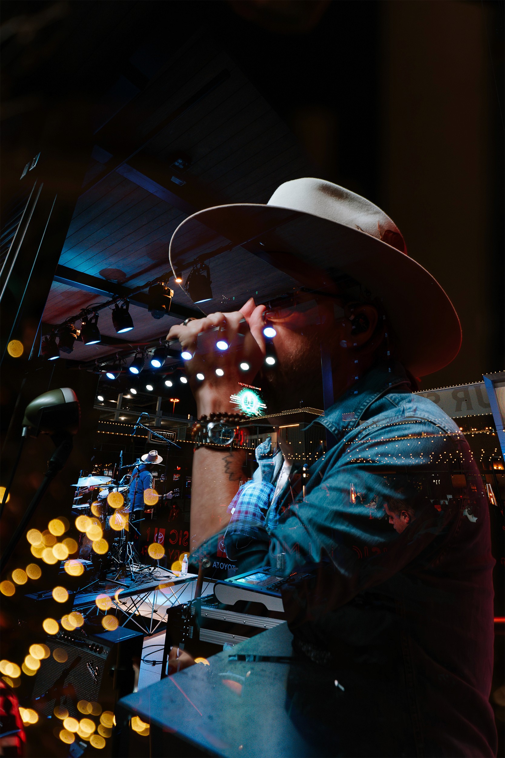 Blended photography of the lead singer from A Thousand Horses, with twinkly lights in the background.