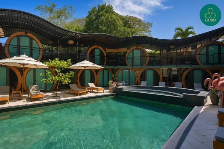 sunloungers fronting buildings near mountain