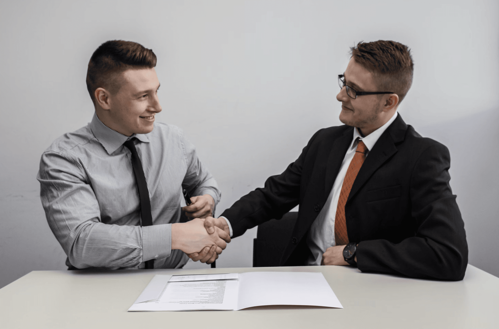 an image of two men shaking hands