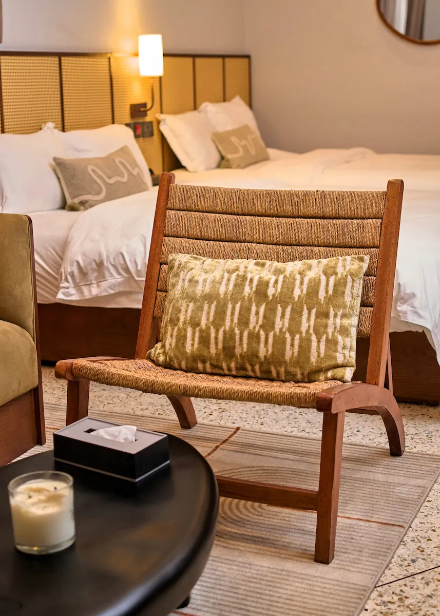 Close up of chair with bed in background