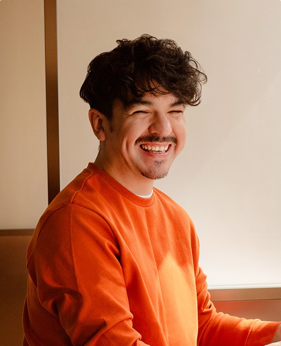 Happy employee candidly smiling