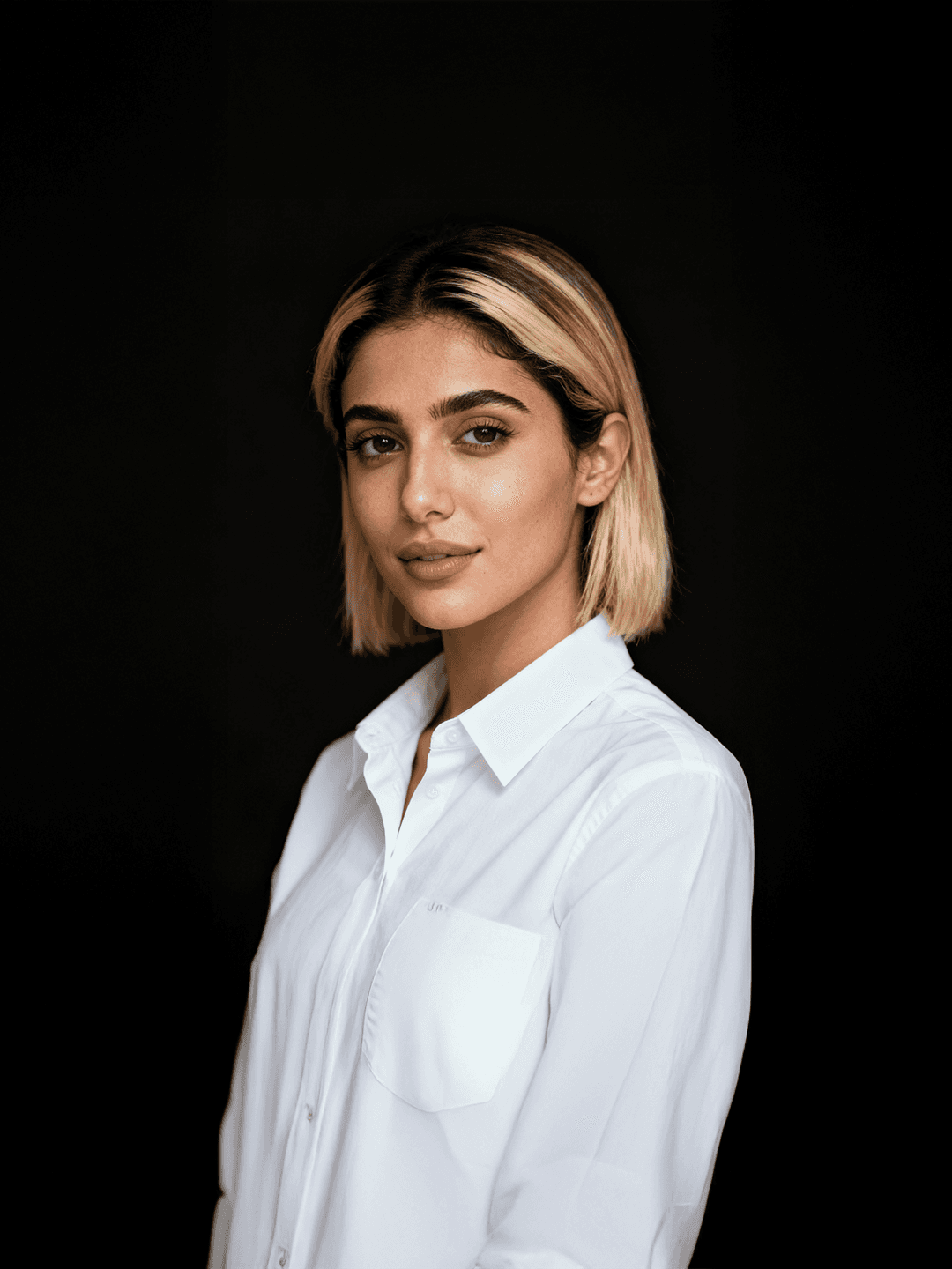 Portrait of a person in dark clothing speaking on a phone