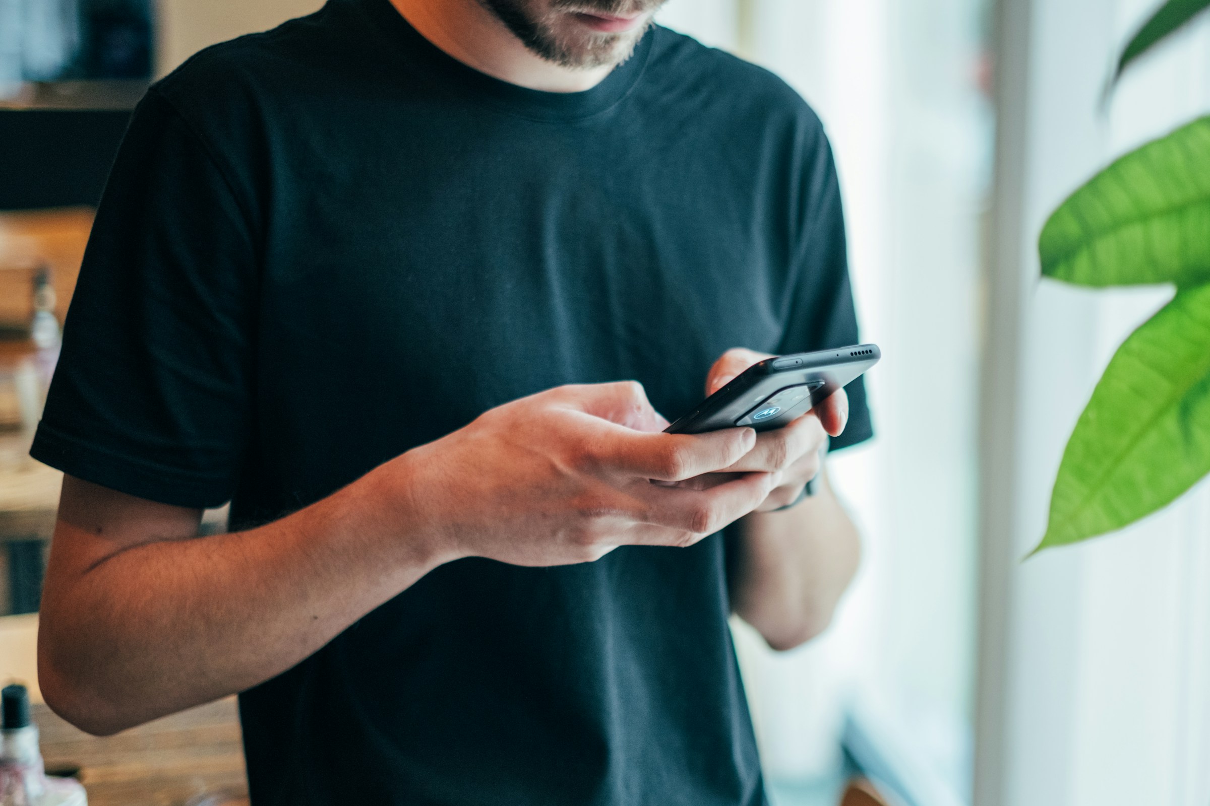 man watching a short video - Short Form Video Trends