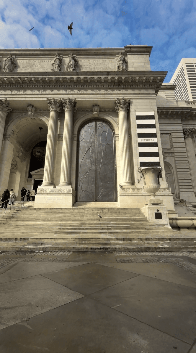 The New York Public Library features a giant Sephora-branded banner and arched bronze doors in a brand activation mockup