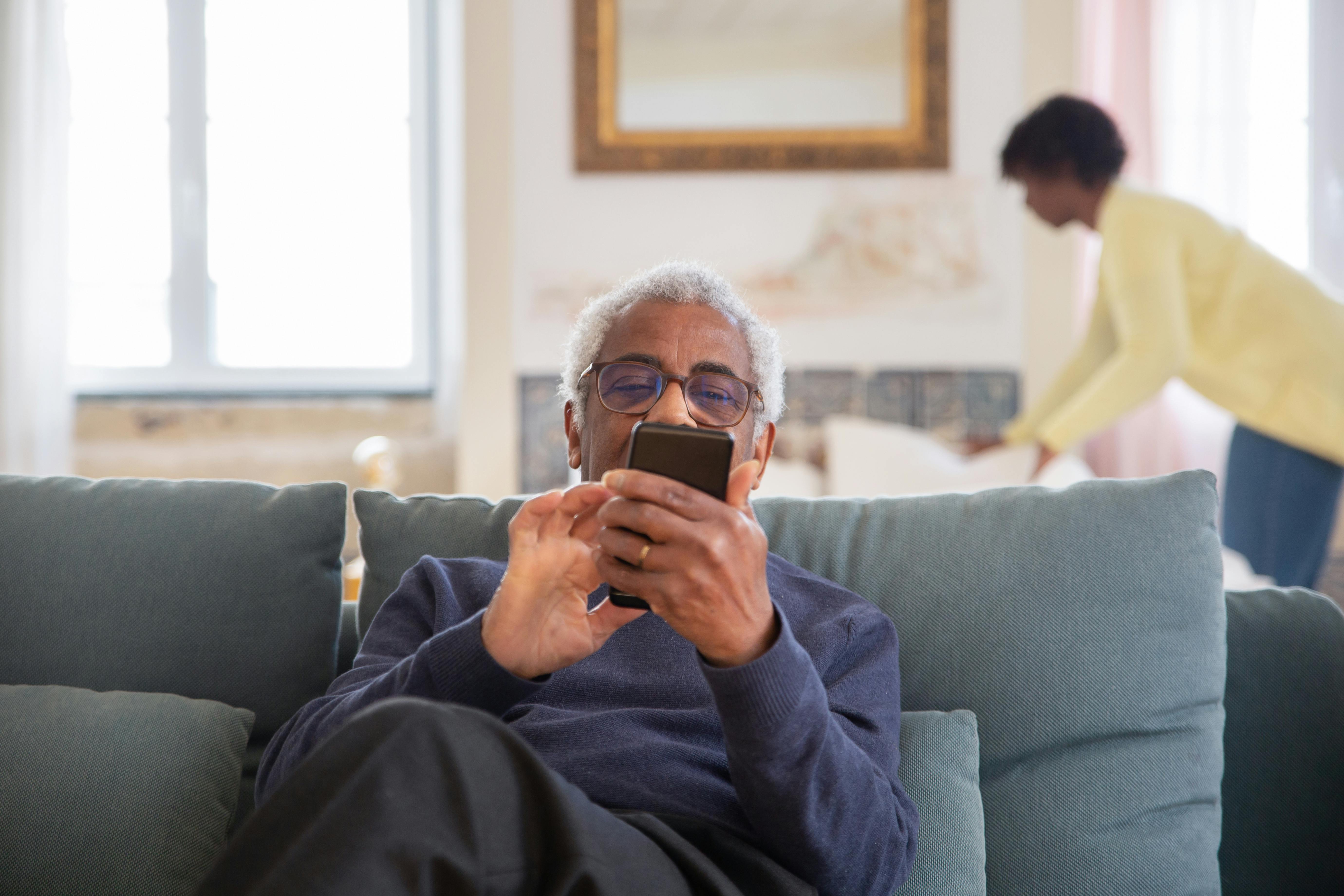 person sitting in a chair in front of a man
