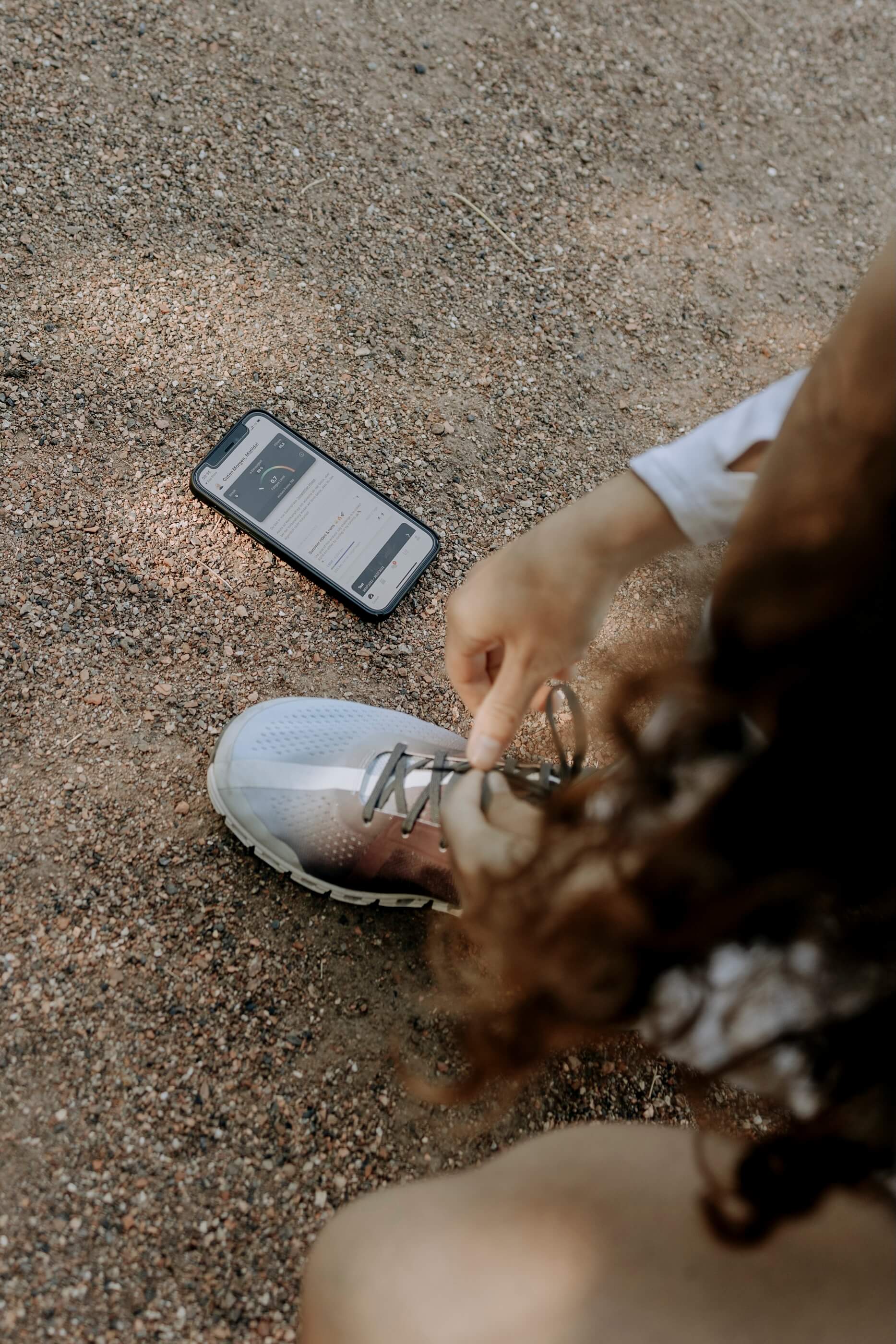 Woman lacing her shoes