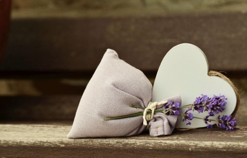 A sprig of lavender, with a bag and a heart