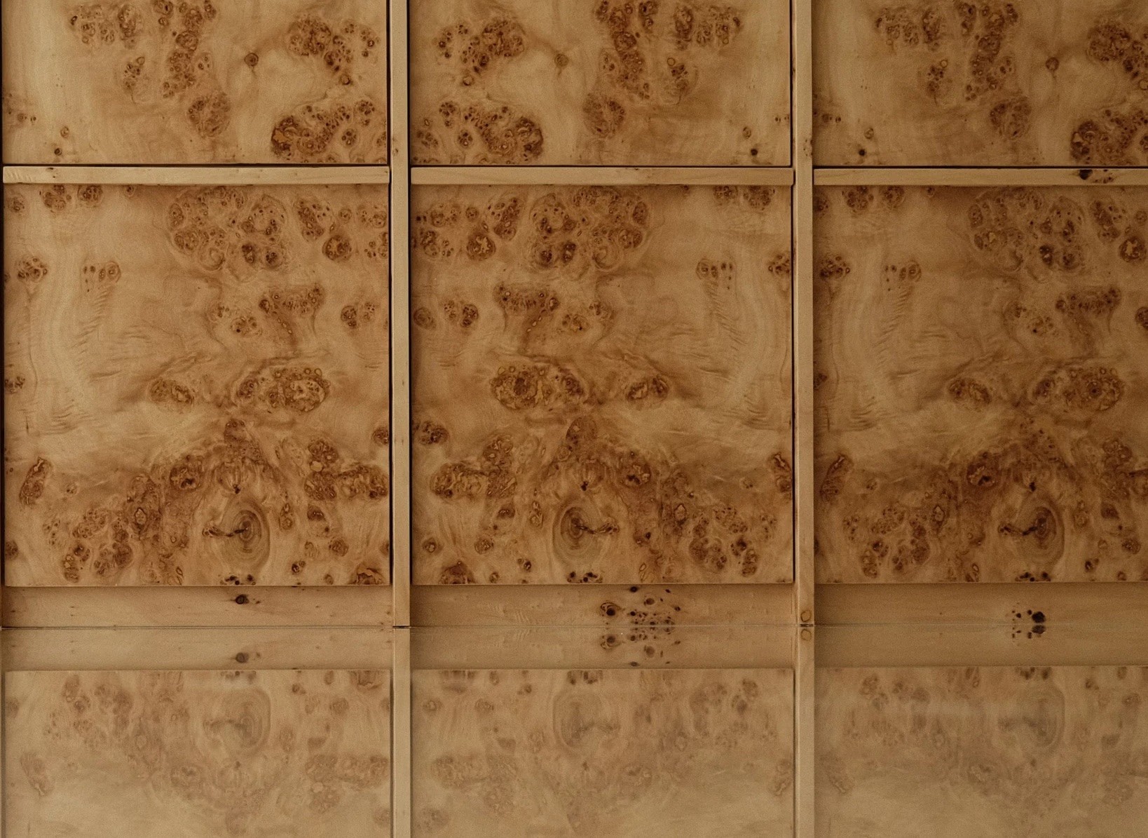 Custom wood panel feature wall with unique grain patterns, bespoke interior design by Persqft Singapore"