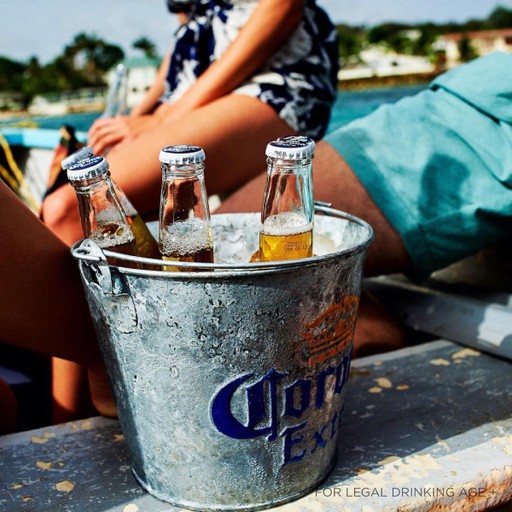 Ice bucket full of Corona's bottles