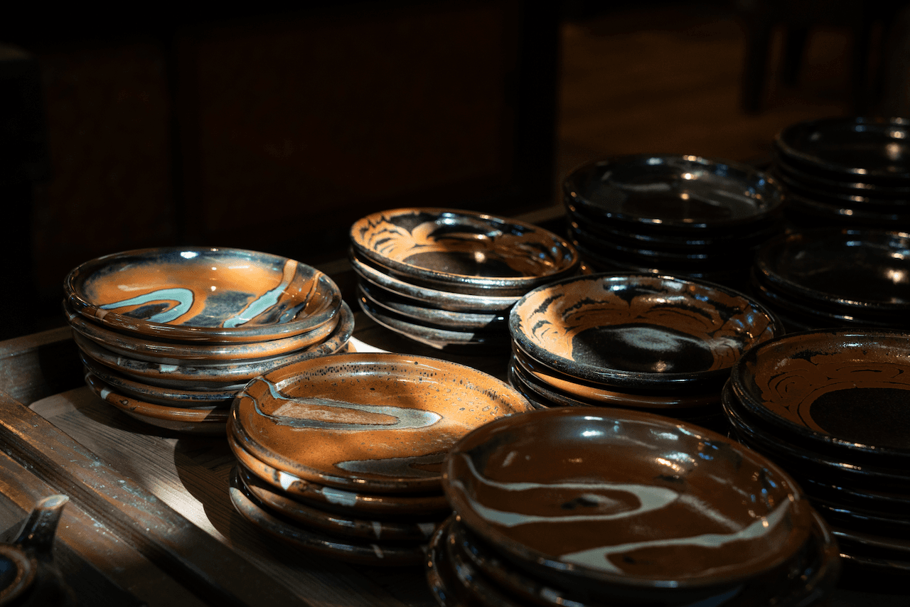 Pottery plates with sun reflecting through from outside