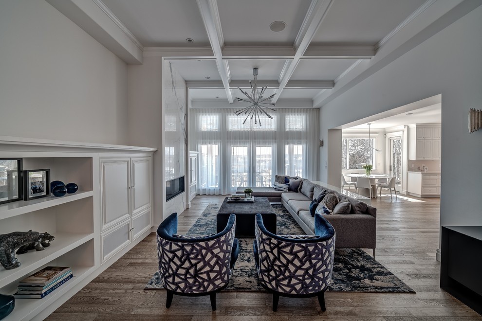 Image of Luxury living room interior design by KHD Homes featuring layout design, furniture, and window coverings.