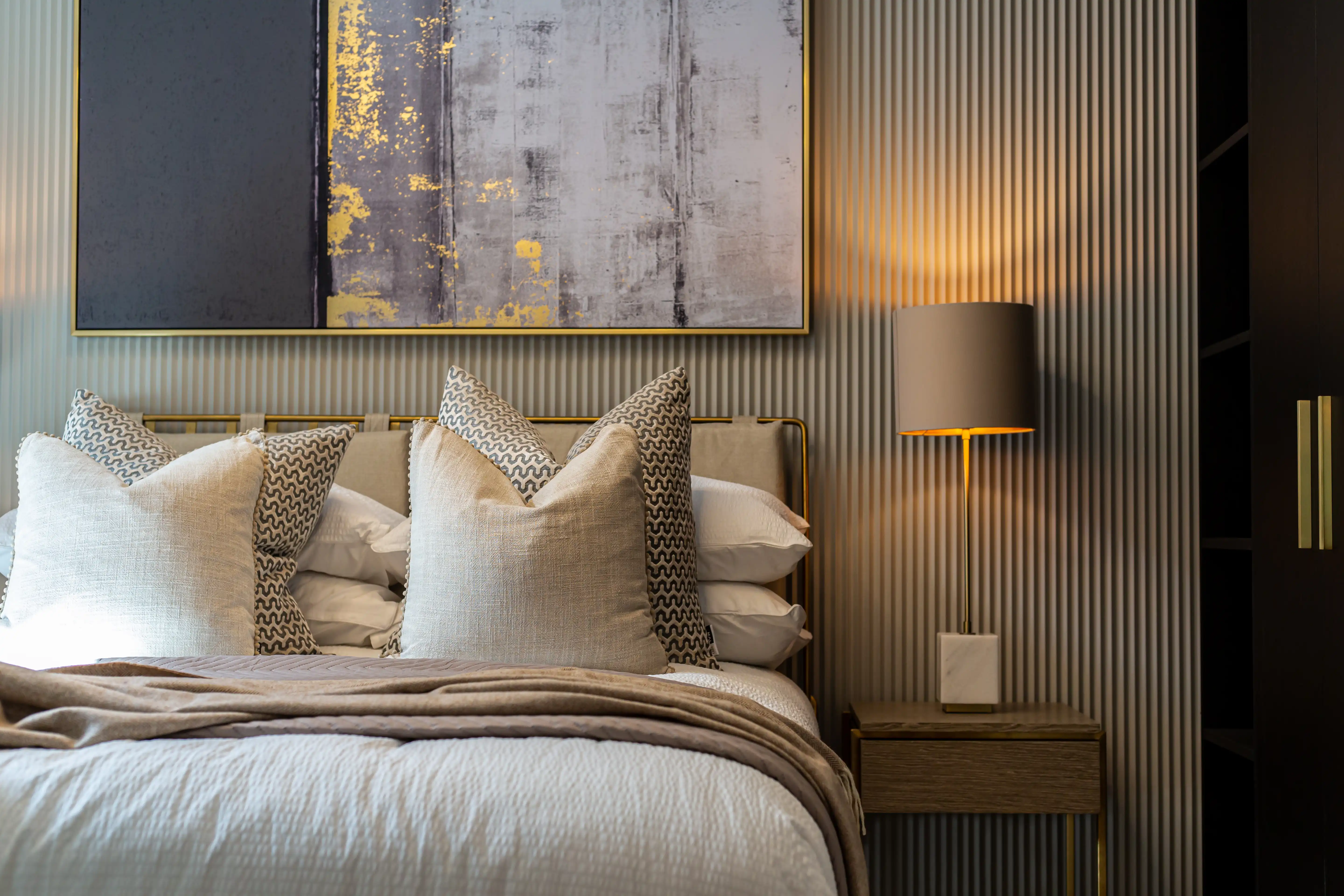 A green butterfly rests on a flower.